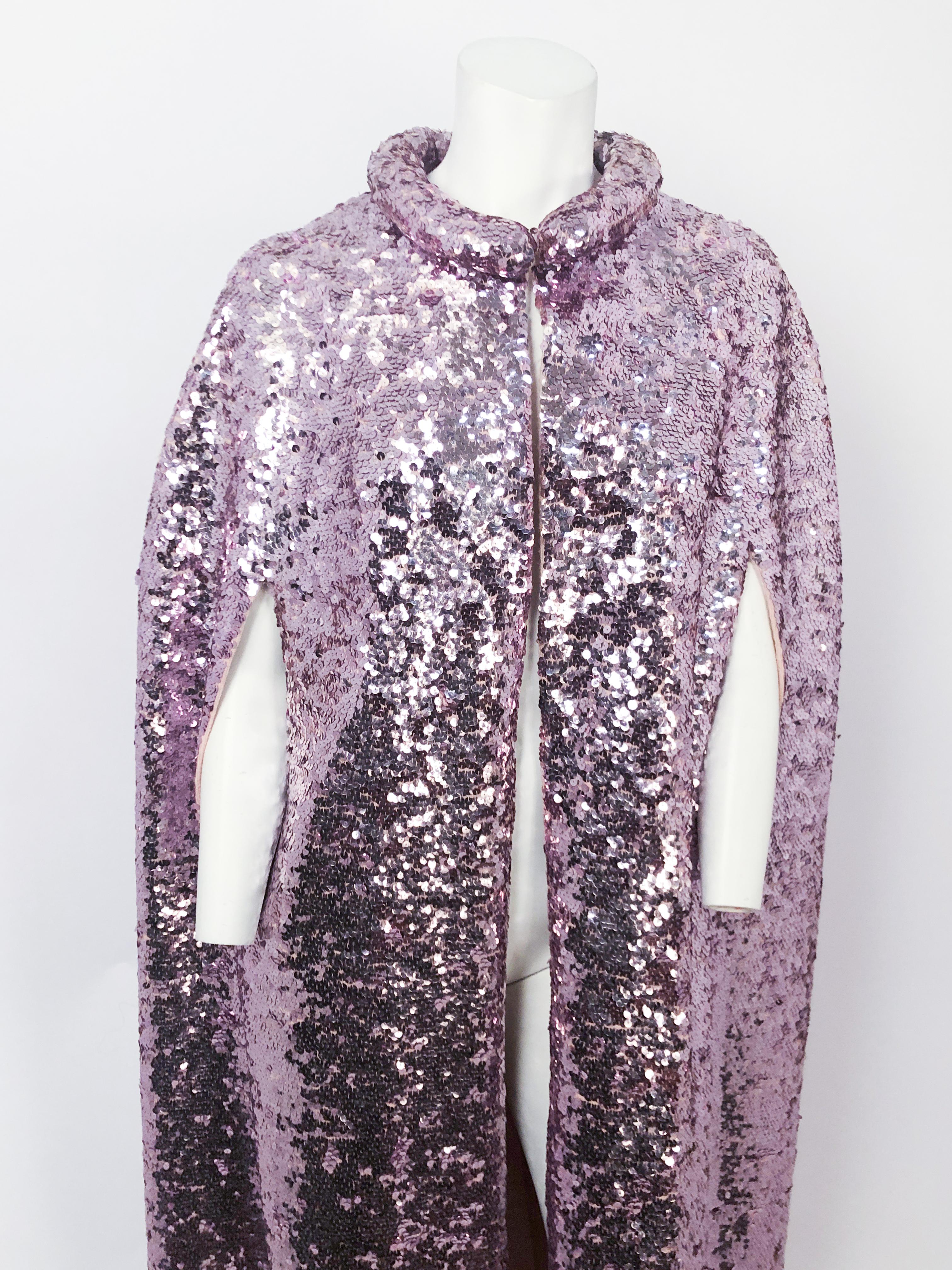 1960s Pink Sequin Full Length Cape with a knit base, arm slits, and a stuffed/rolled collar. Whoever wears this piece should be at least 5'8