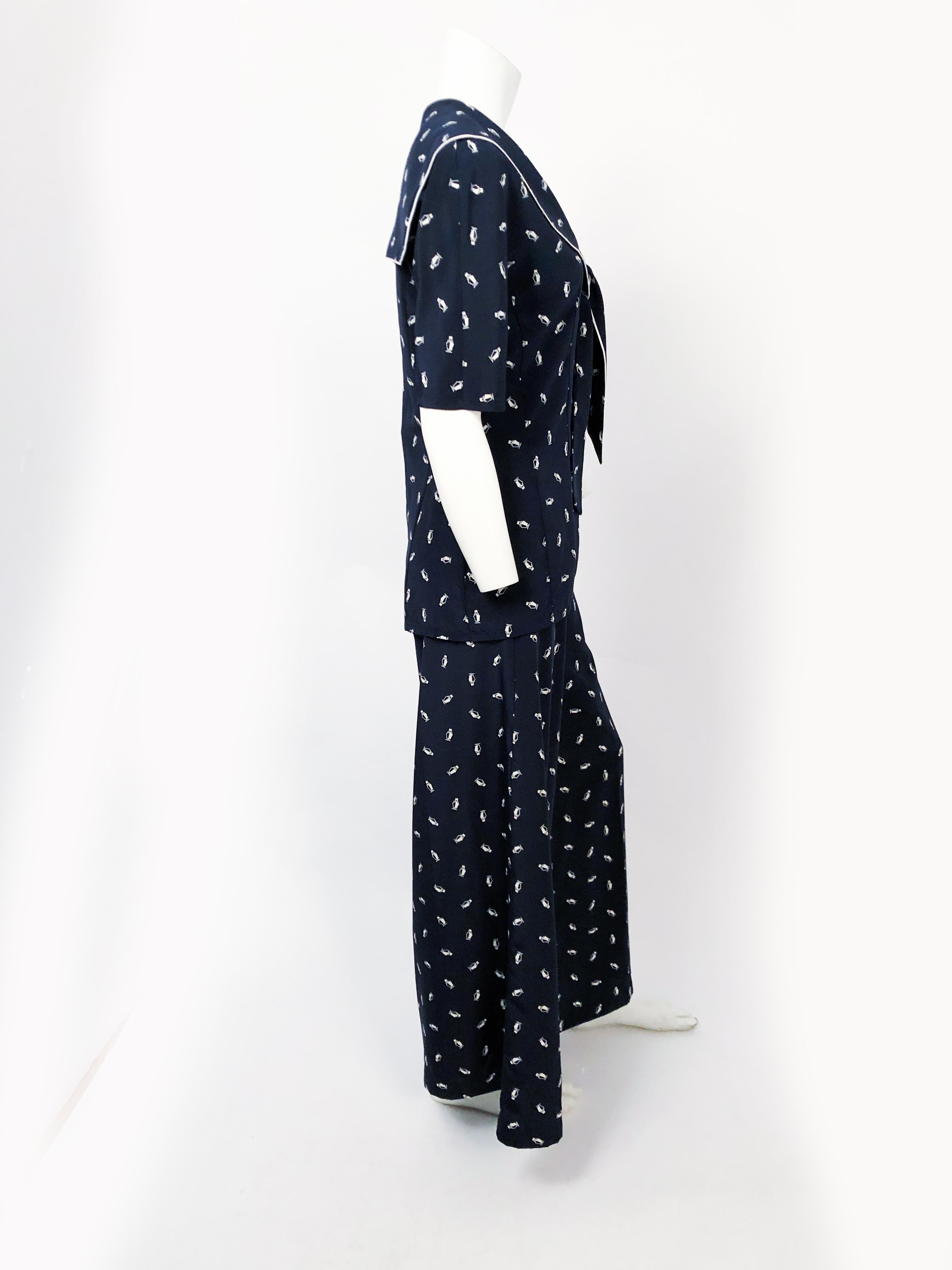 Navy and White 3-Piece Set (Top, pants, and belt) with Steam Boat Print, high-waist pants, wide legs, sailor tie collar, and whit trim. In the style of the 1930's and 1940's.