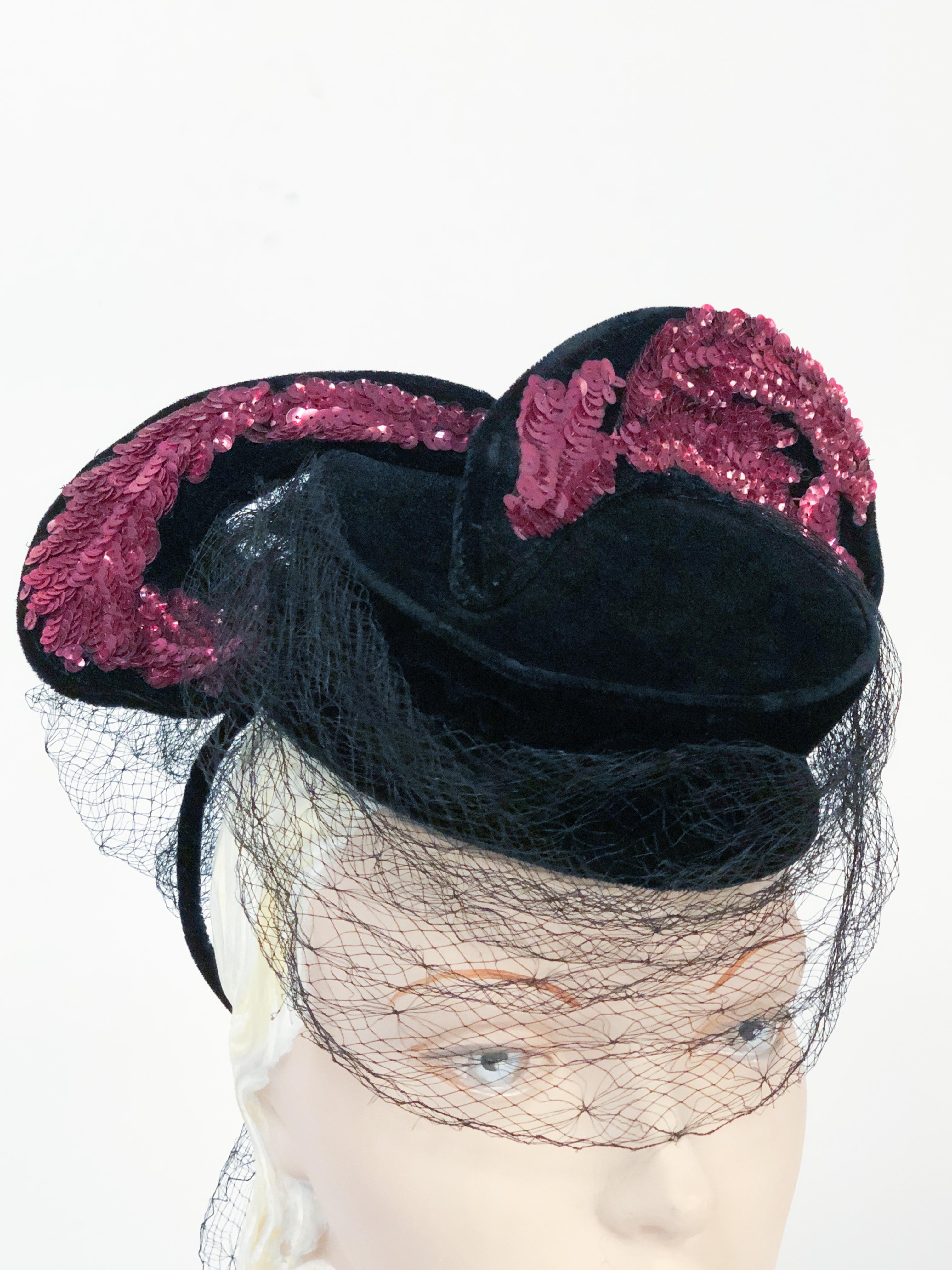1940s Black Velvet Hat With Magenta Sequin Wings and Draped Veil and bow on the back of the hat. Hand Rolled metal head circle is used to secure the hat to the head