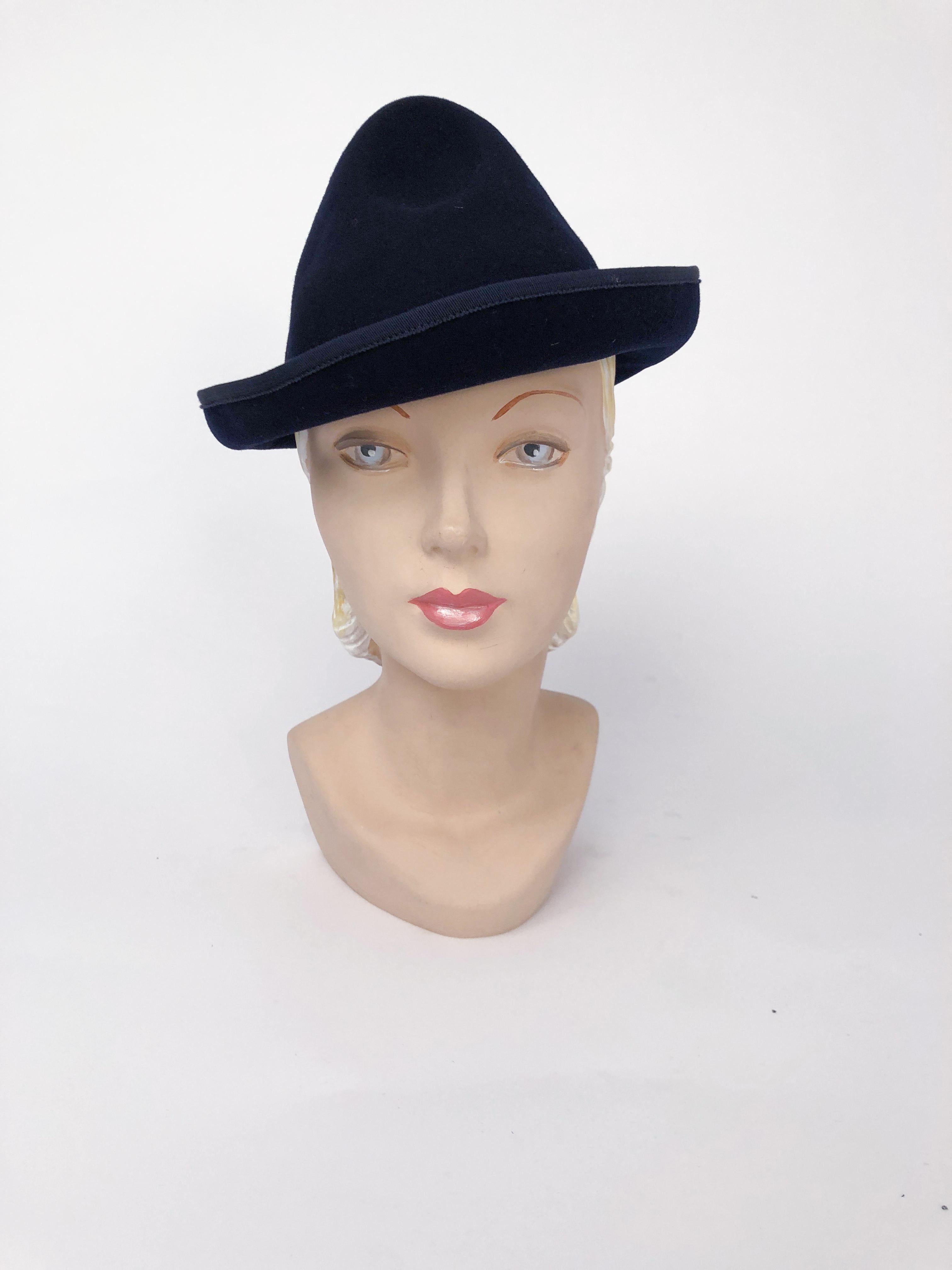 1930s Navy Felt Cone Hat with grosgrain tim and band. Sculptured crown and rolled brim