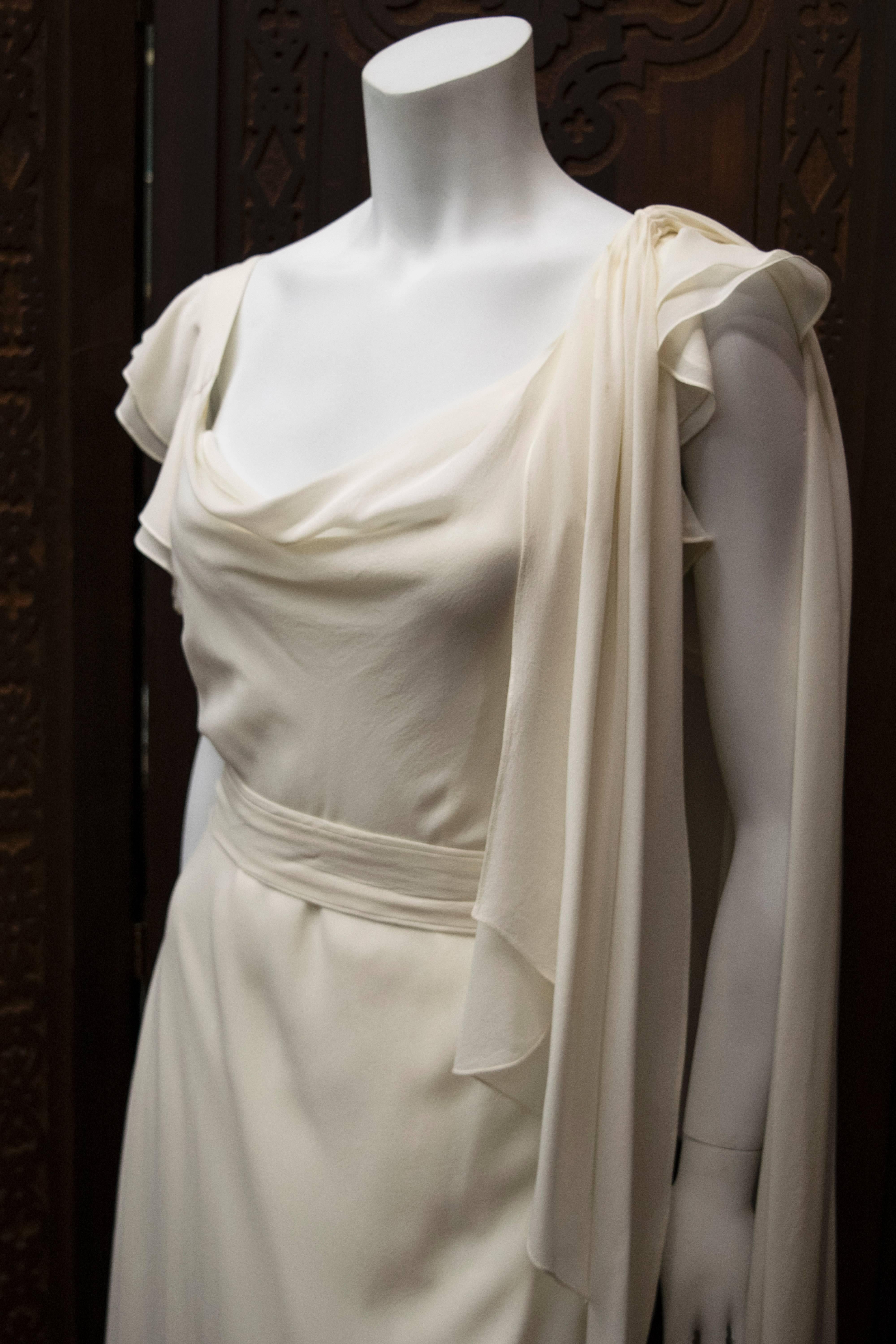 1930's Ivory Silk Chiffon Dress.
A beautifully preserved 1930s ivory silk chiffon gown. This piece is an excellent example of 1930's glamour and is pictured with original belt and sash. 

B 40
W 36
H 40
L 59