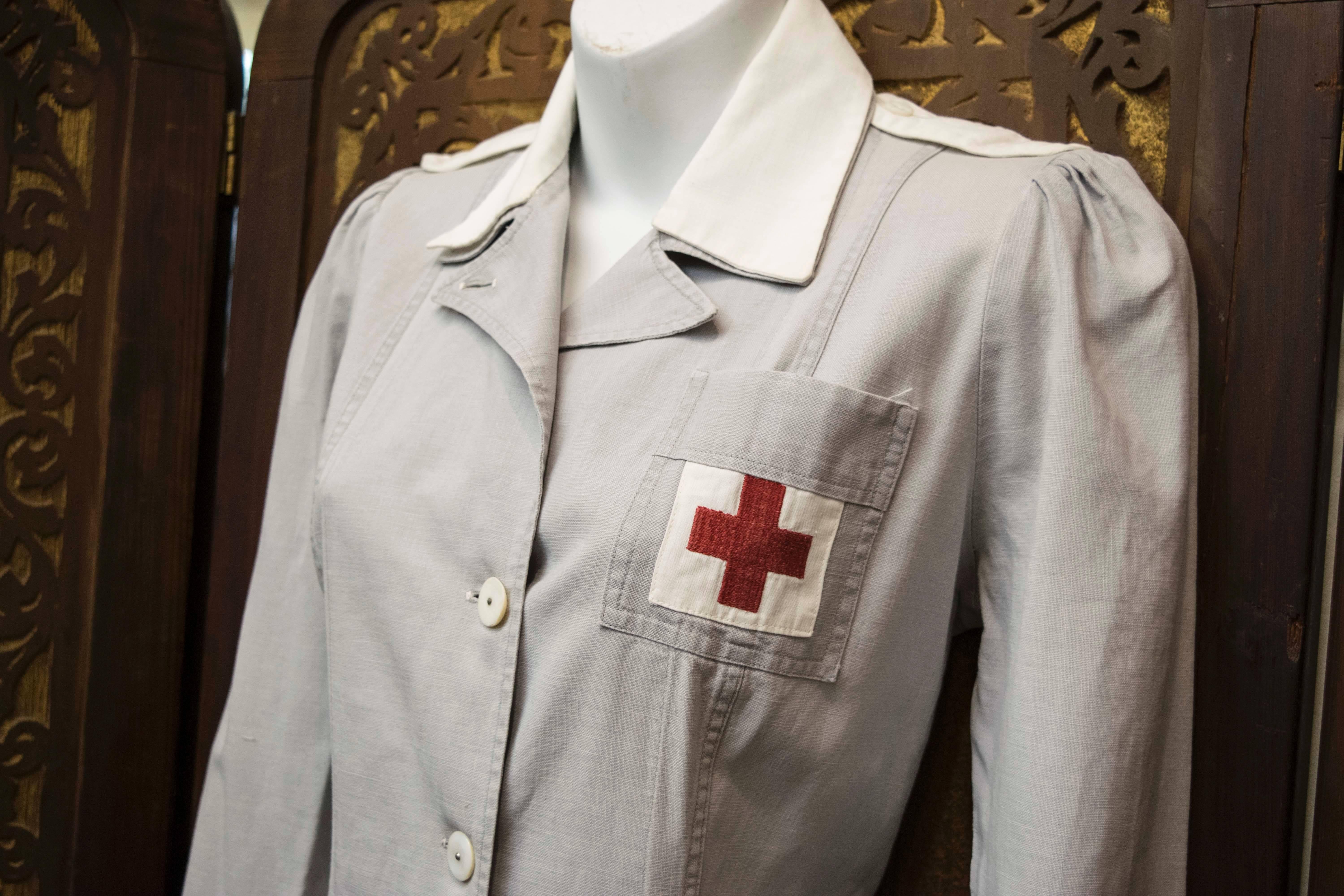 Pre WW2 Nurses Uniform. 
Beautifully preserved 1930s Nurses uniform, with original shell buttons and detachable epaulettes. Made from a cotton linen this piece has wonderful historical provenance as well as being a fabulous item to wear. 

B