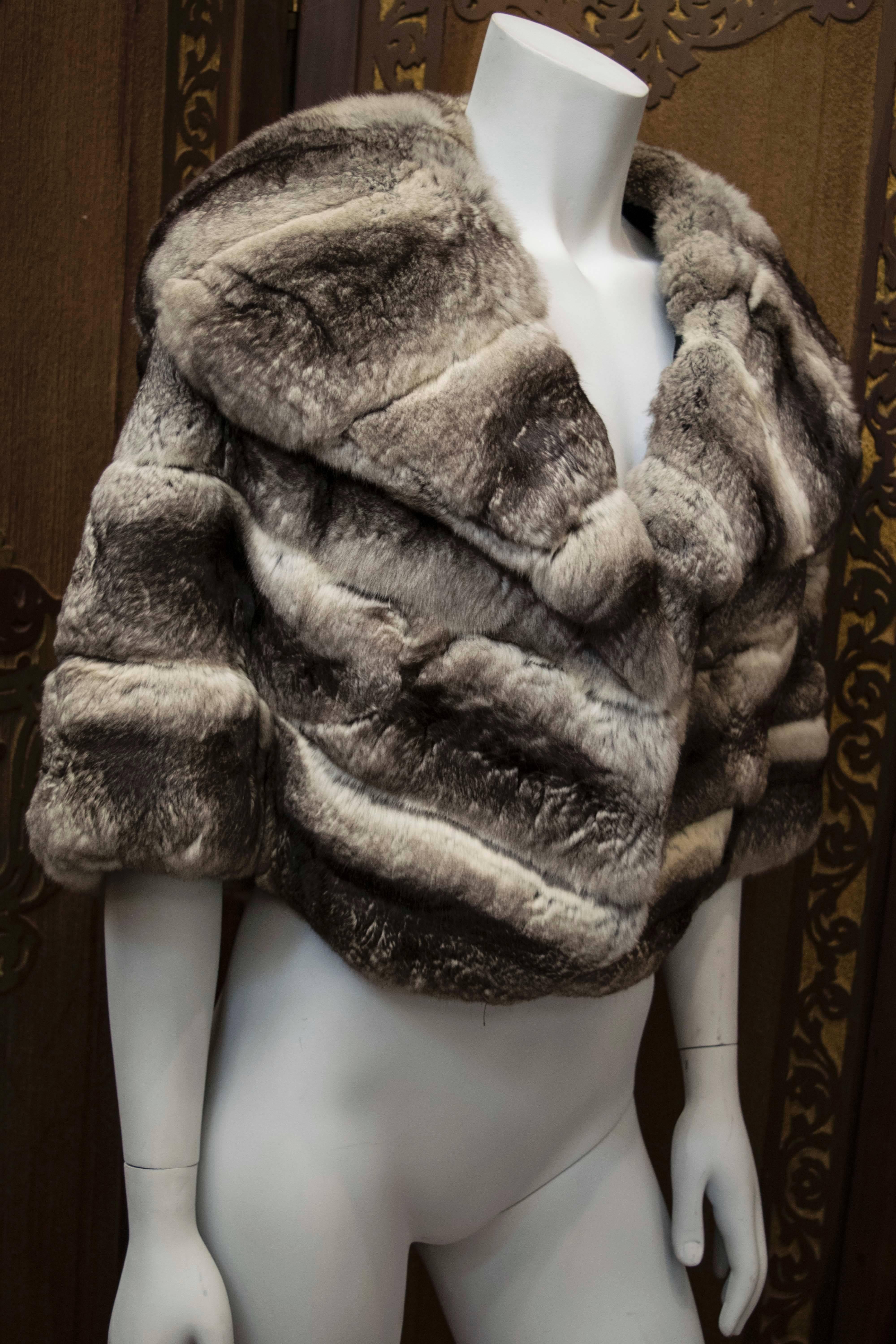 1960s Chinchilla Fur Stole.
 A glamorous 1960s natural Chinchilla fur stole with peeked lapel collar. The fur is beautifully soft and full. This piece is the height of luxury. 

Shoulders 44
L 22