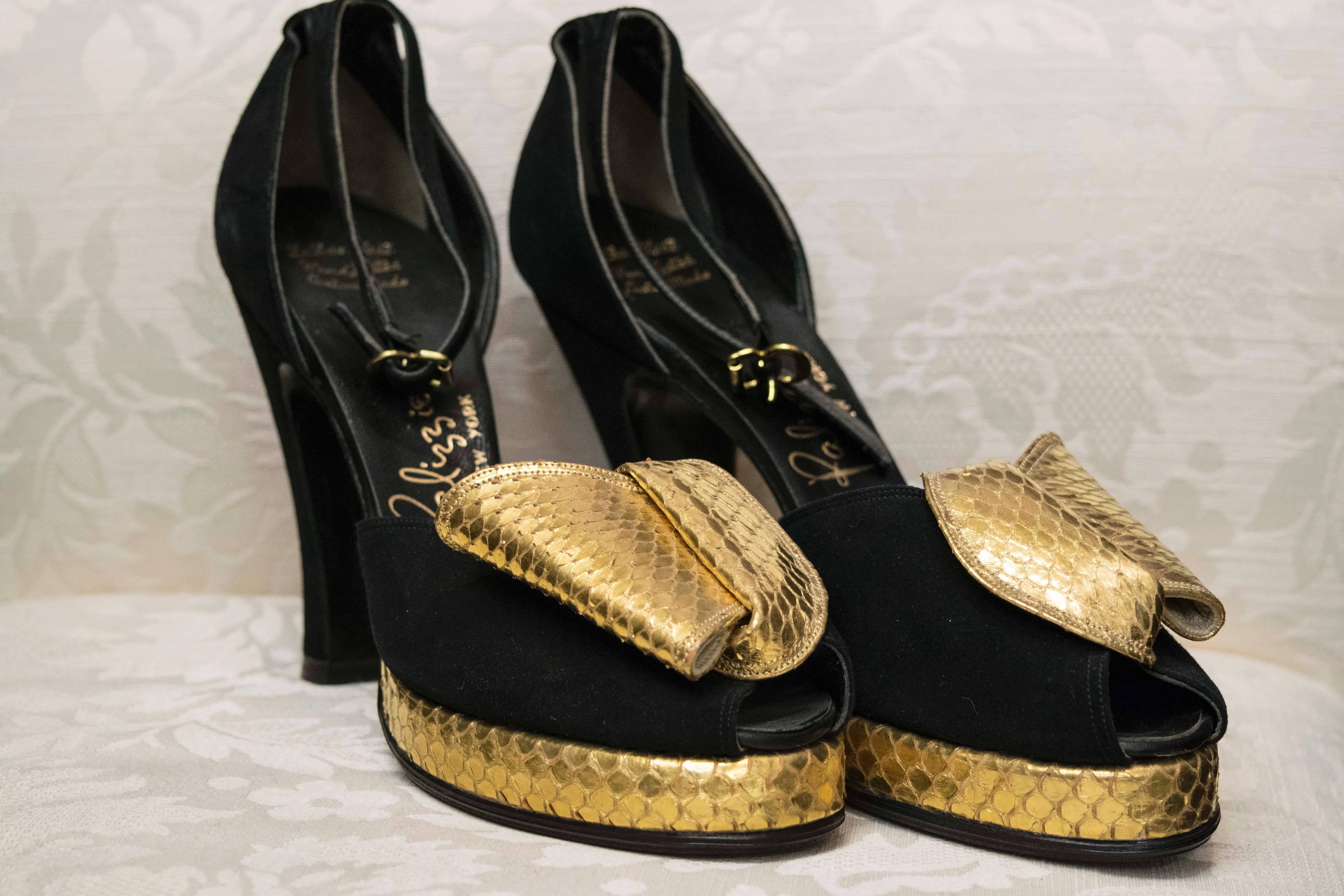 1940s Gold Snakeskin Platform Shoes

Mint condition never worn and absolutly gorgeous '40s platform shoes.  They are suede, with a gold leaf real snakeskin detail on the peep toe. 

Size 6N