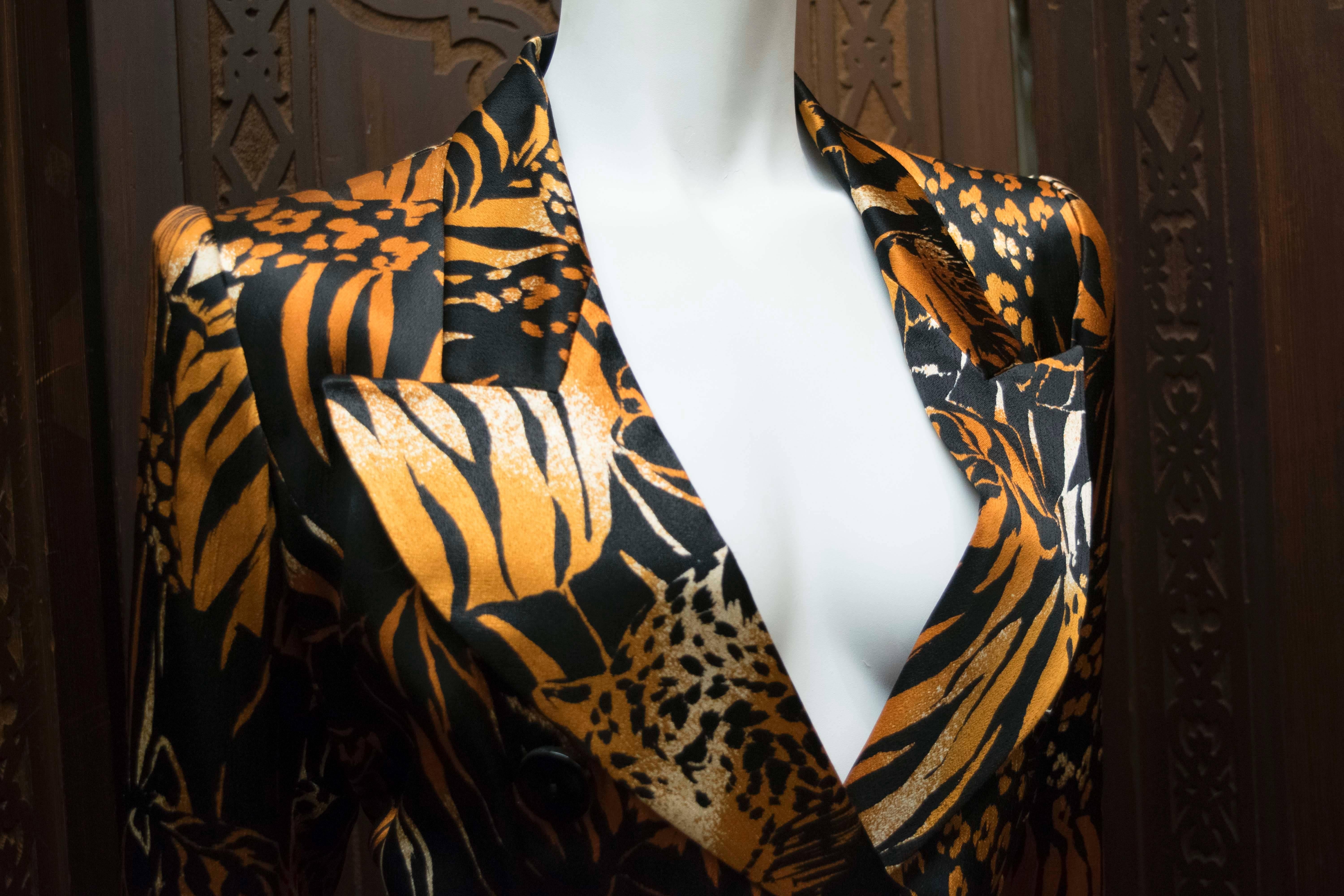 Yves Saint Laurent Animal Print Double Breasted Blazer 

Stunning silk double breasted blazer produced by Yves Saint Laurent in the 1980s. This piece has a wonderfully bold animal print featuring Lions, Tigers and Jaguars. Perfect for anyone