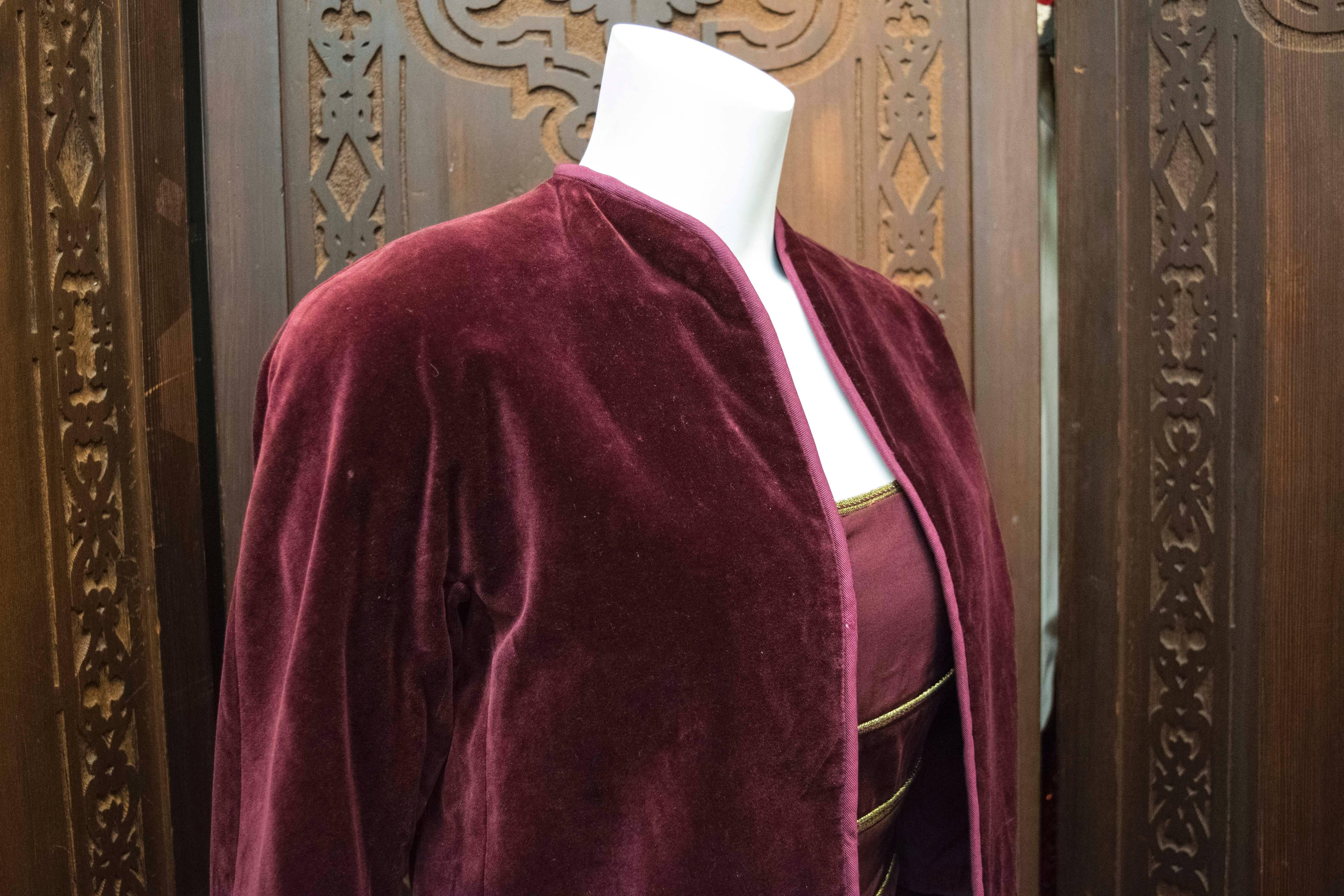 Gianni Versace Velvet Two Piece 

A late Gianni Versace two piece. The bolero jacket is silk lined, there is a mark on the pipping on the lapel. The top is also velvet, with gold thread stripping. 
This would be a great addition to any lover of