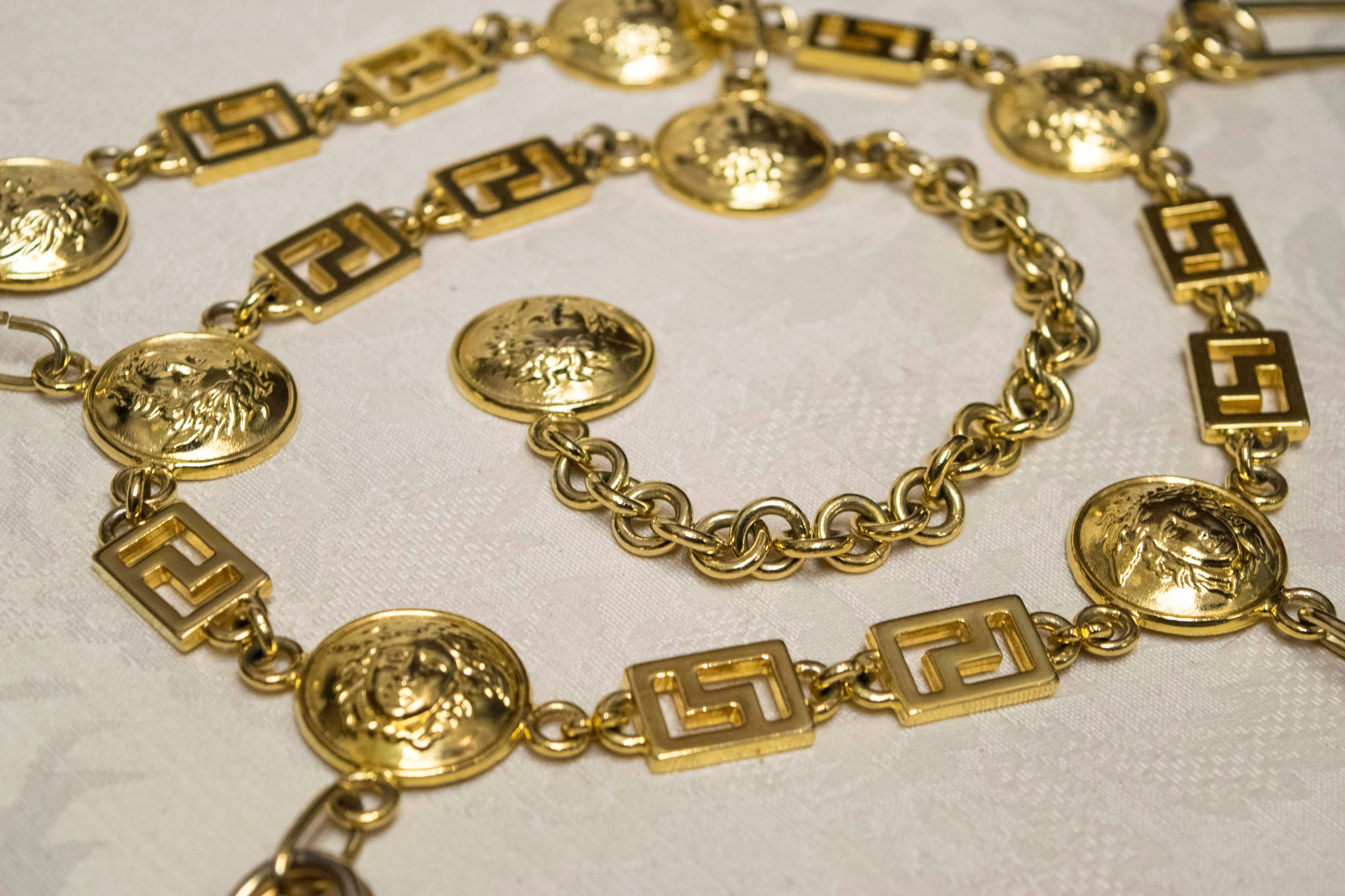 Gianni Versace Gold Toned Chain Belt Iconic Medusas and Safety Pins.

An iconic Gianni Versace belt from the 1980s. The piece is unstamped, but come with original bag. 

The piece extends 25 inches - 30 inches. 
