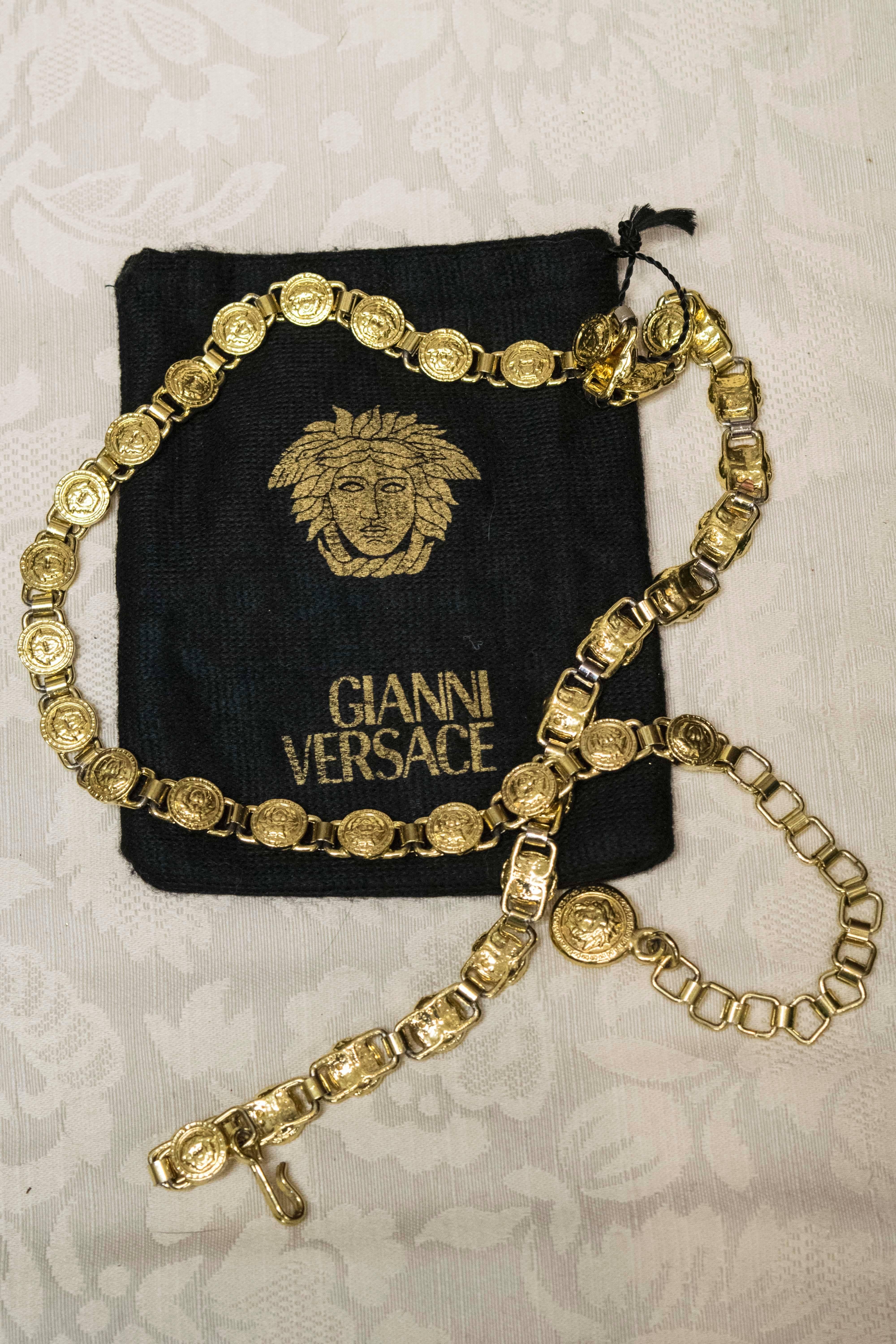 Beige Gianni Versace chain belt.