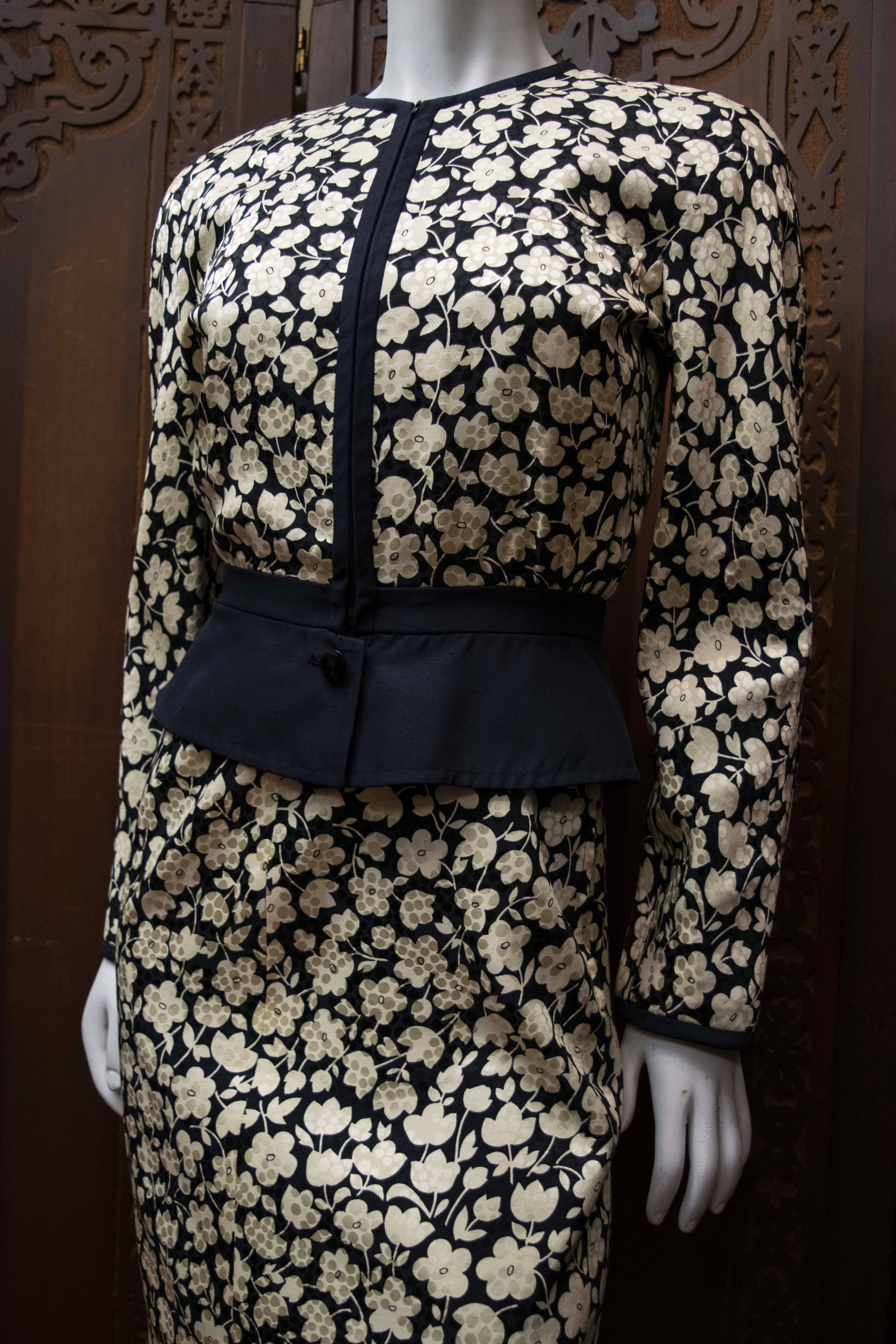 1980s Valentino Floral Dress and Jacket

Beautiful black and cream floral dress and jacket. Each piece is wonderful by themselves, and great as an ensemble. 

B 34
W 28
H 40
L 32