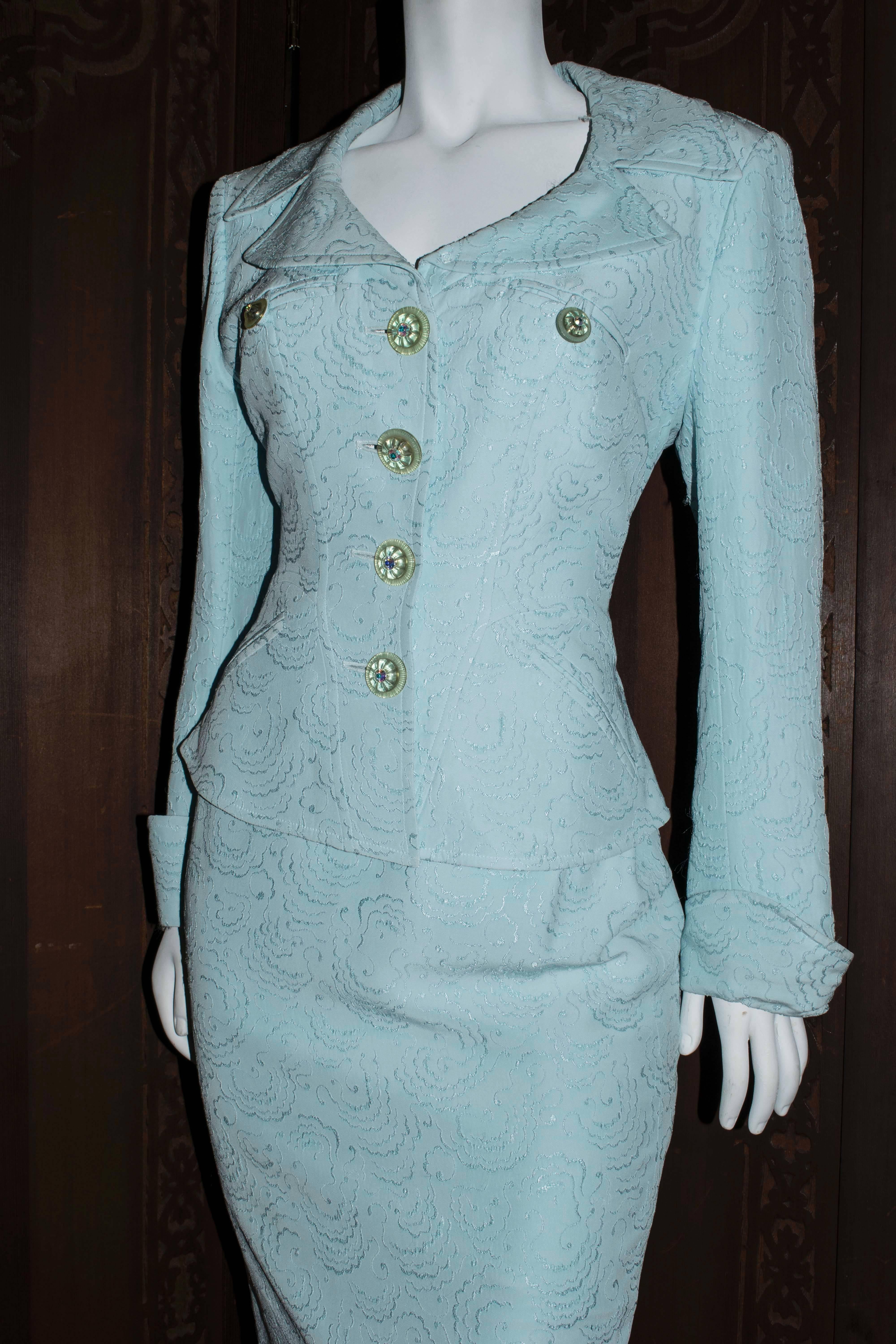 1990s Christian Lacroix Powder Blue Two Piece Skirt Suit.

Stunning tailored suit Designed by Christian Lacroix with cloud detail embroidery and decorative glass and rhinestone buttons. 

Size 40

B 40
W 38
H 36
L 46