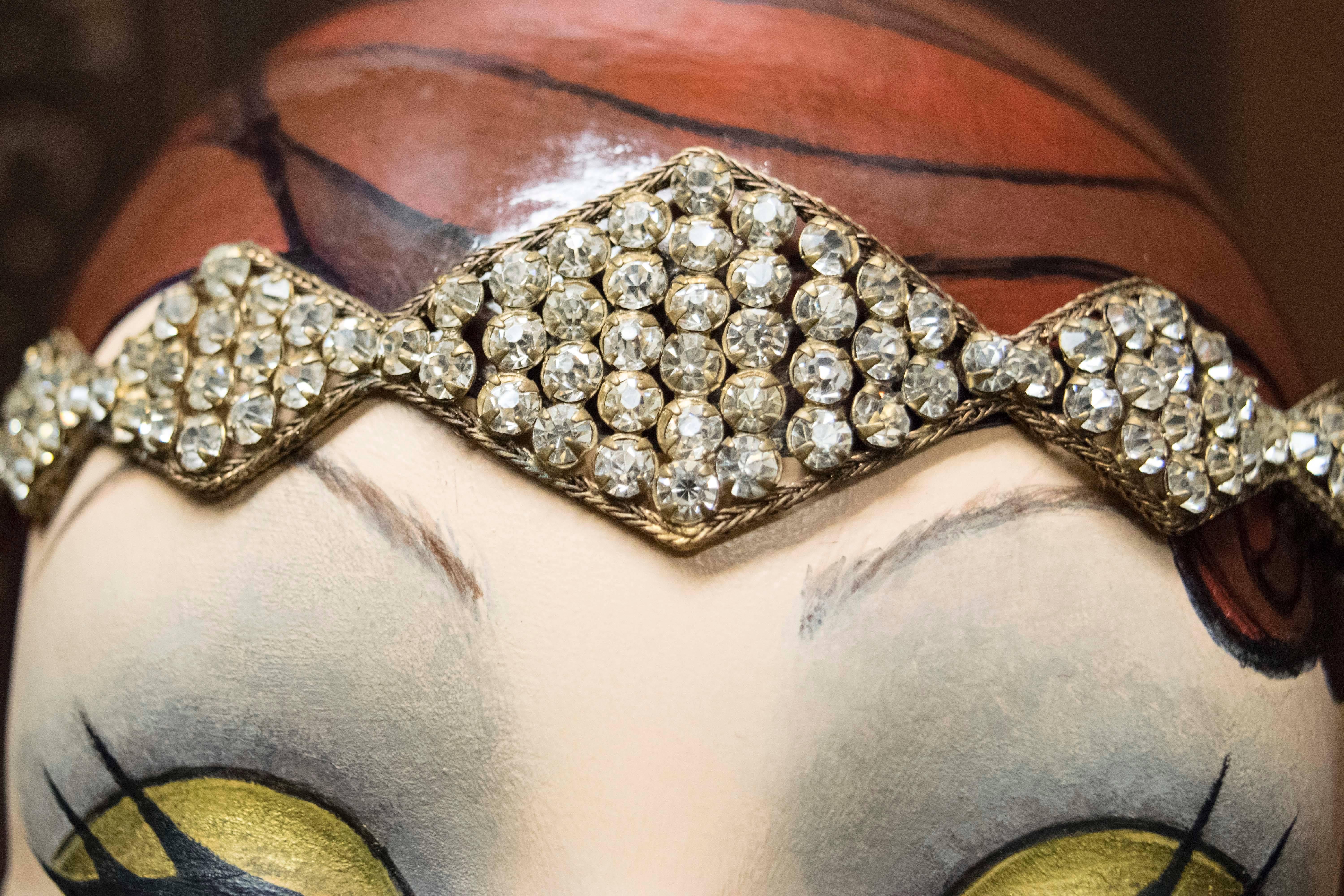 
Stunning early 1920s headband beautifully preserved, and unused since the 1920s, stored in original box. The piece has Swarovski crystals in a brass filigree weave. 
Wonderful piece of Art Deco history. 
