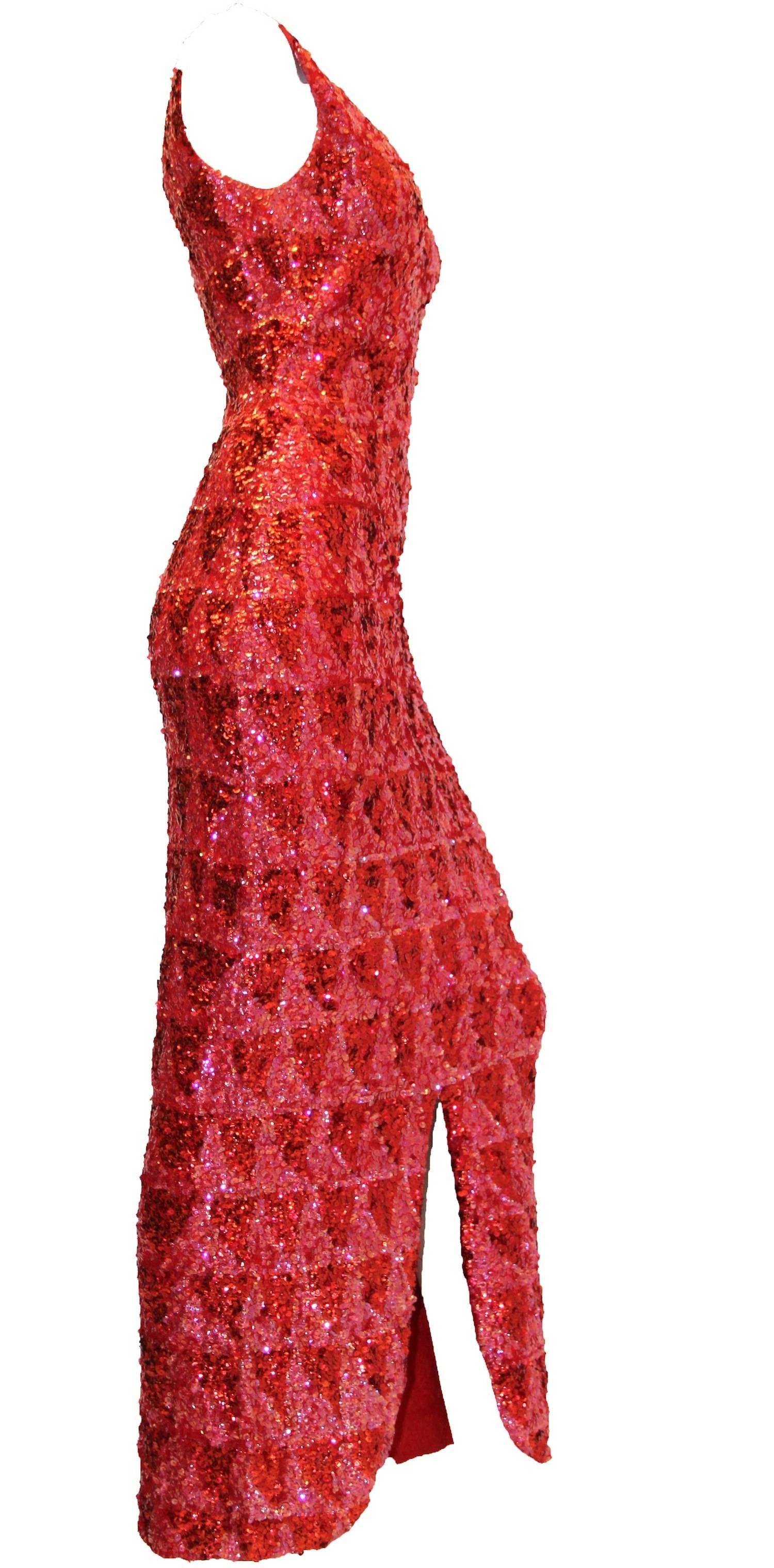 One of a kind 1950's/60's heavily hand sequined custom made knit dress in shades of red and pink. V neckline, form fitting silhouette and front slit makes this dress a real show stopper! 

Measurements: ( this dress is knit and therefor it does