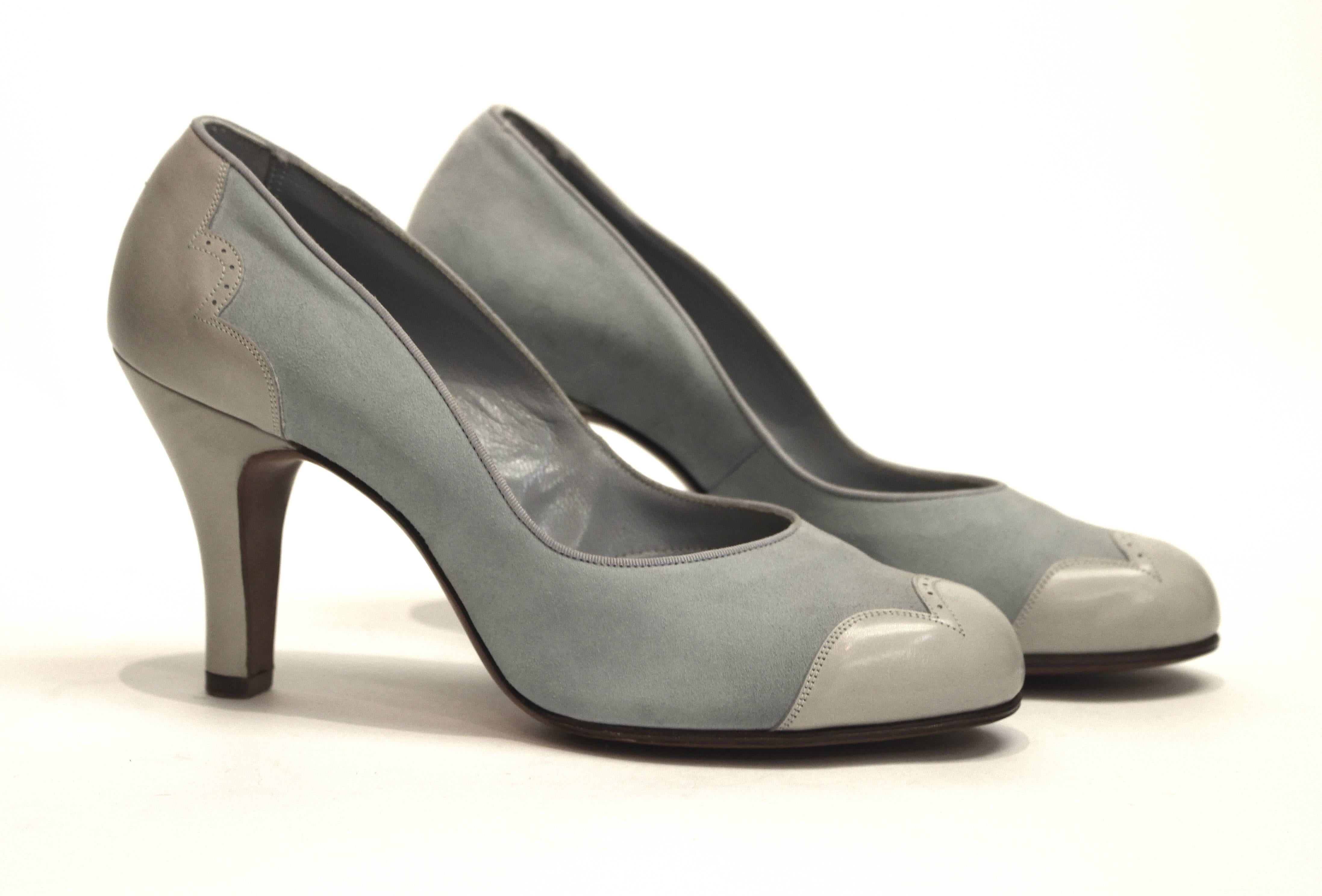 1950s pale blue suede spectator heels. 

Measurements:
Insole (toe to heel): 9 1/2