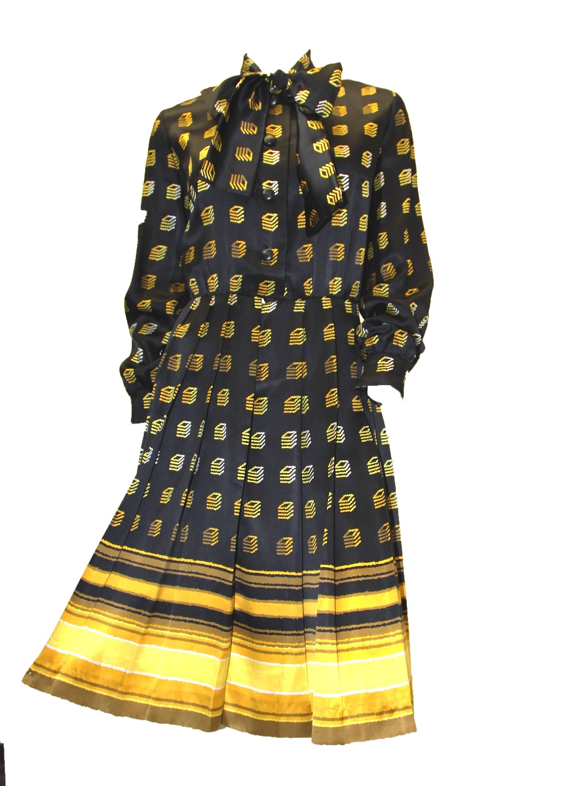 Givenchy 1960s Silk Knife Pleat Geo Print Dress. Front bow ties at neck, long sleeves.

Measurements:
Shoulder: 16