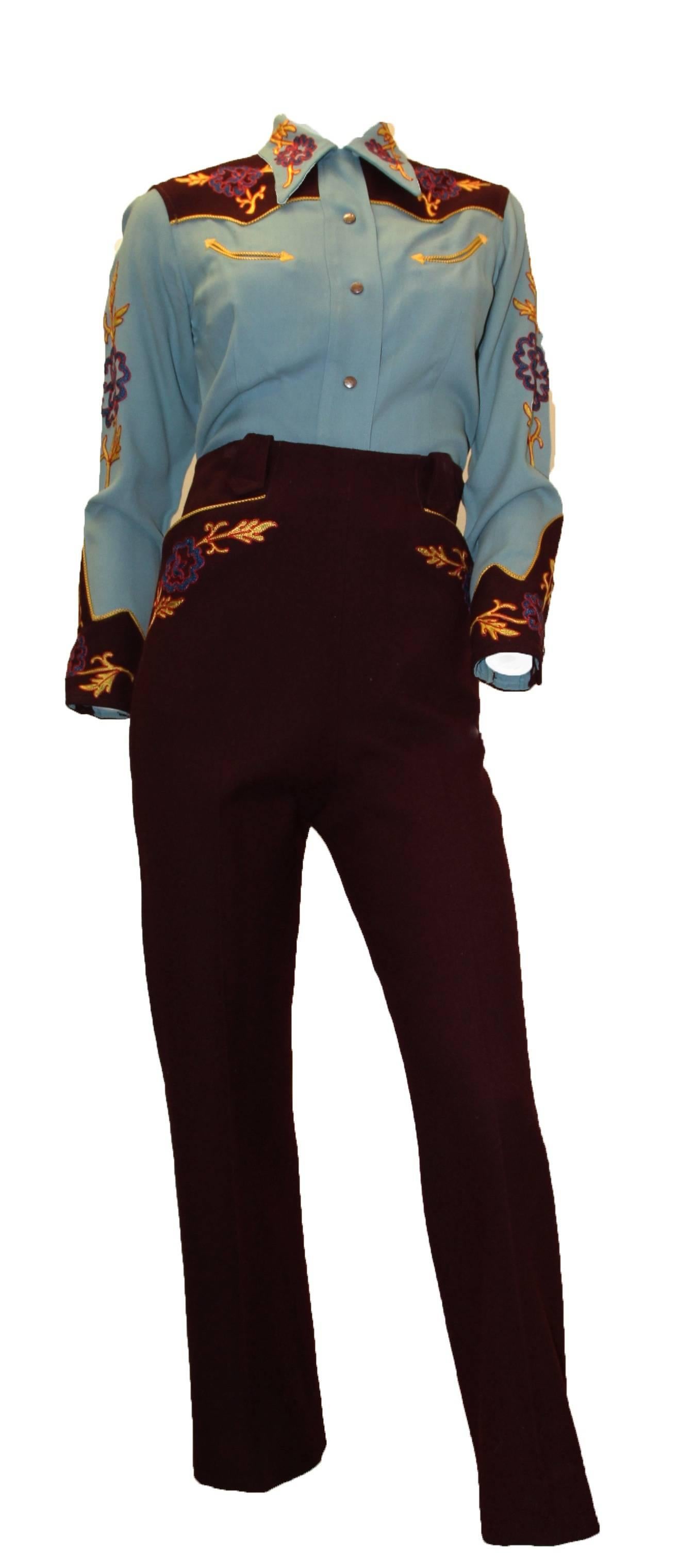 1940s maroon and slate blue Western shirt and high waisted pant set with contrast yellow, red, and blue embroidery. Wool gabardine. Pearlized snap button closure on shirt front and cuffs. Functional piped smile pockets. Side zip closure on pant.