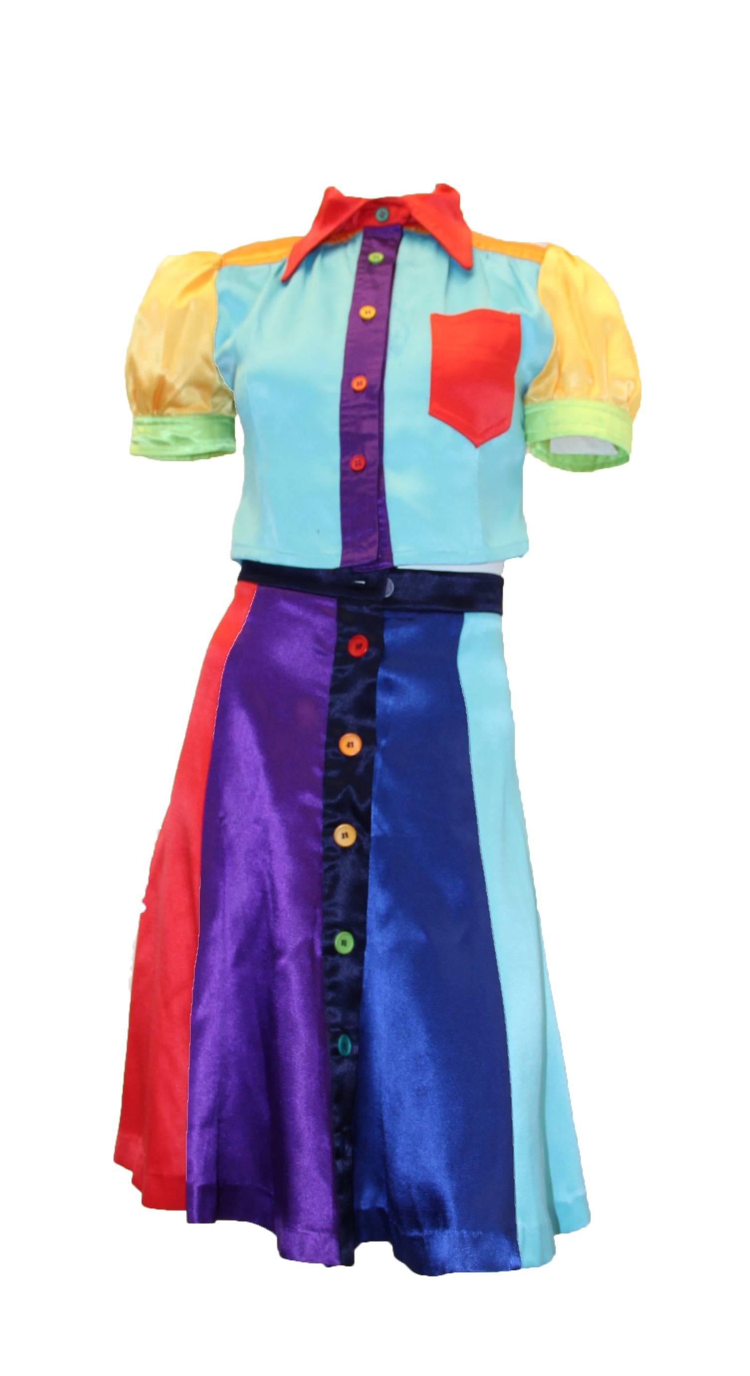 1970s Mr. Freedom mod rainbow two-piece. Buttons up front of blouse and skirt
