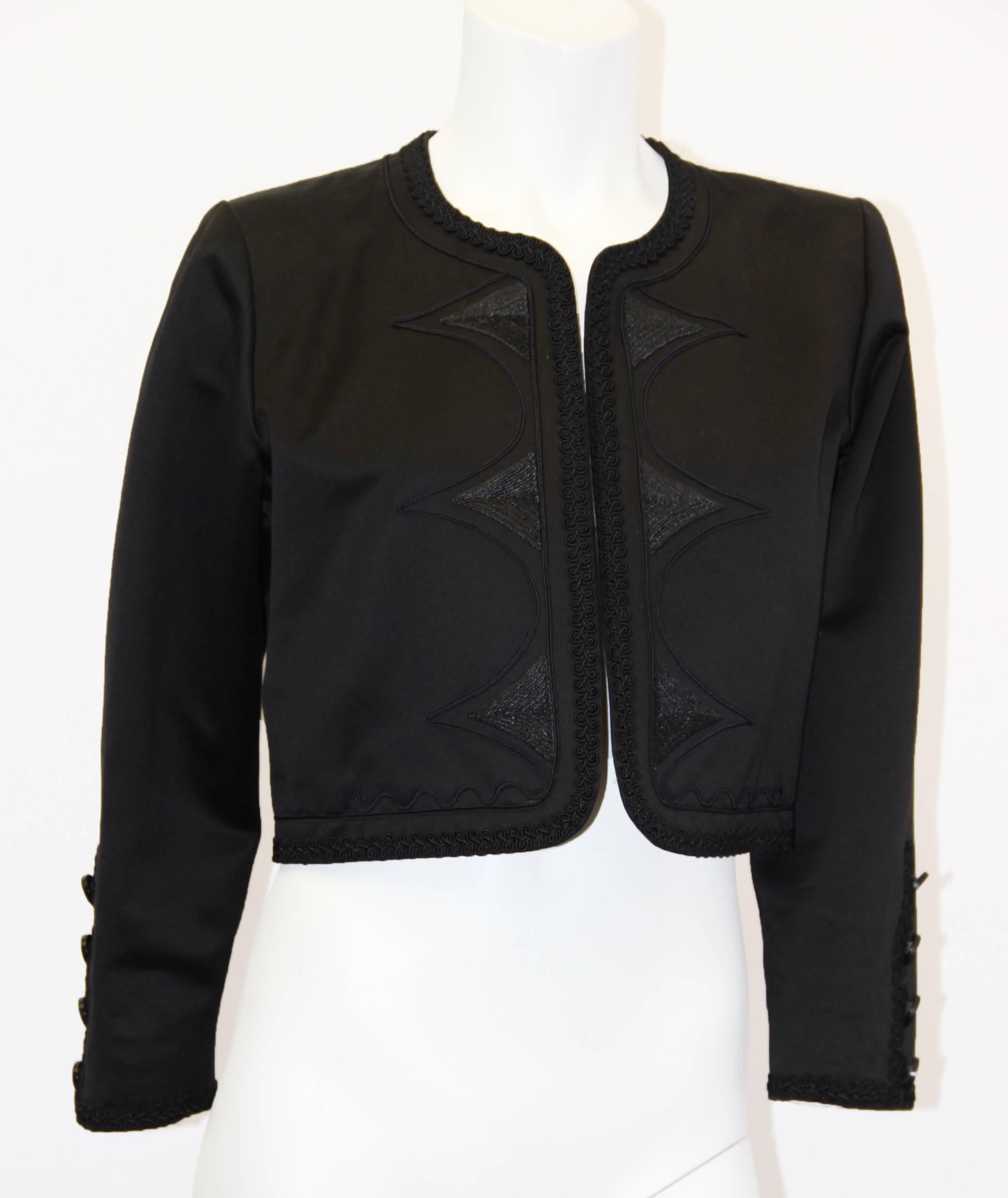 90s Yves Saint Laurent bolero. Raffia embroidery, scalloped trim along edges throughout.  Four, 8 pointed star stamped buttons on cuffs.  (sleeve length is 21 inches, shoulder seam to cuff)