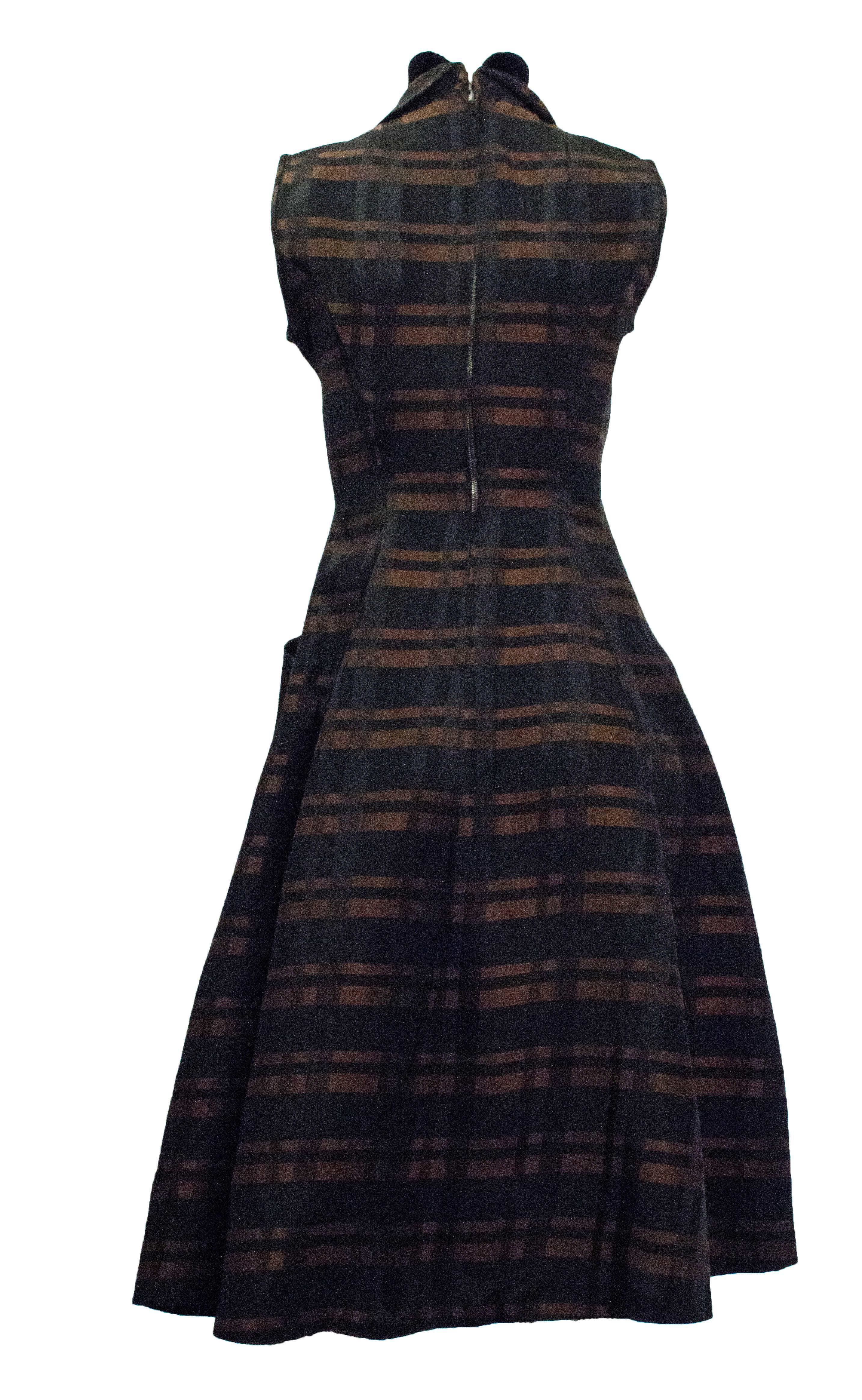 50s Bronze and Black Plaid Dress with Black Velvet Trim. Stand up collar with velvet bow.