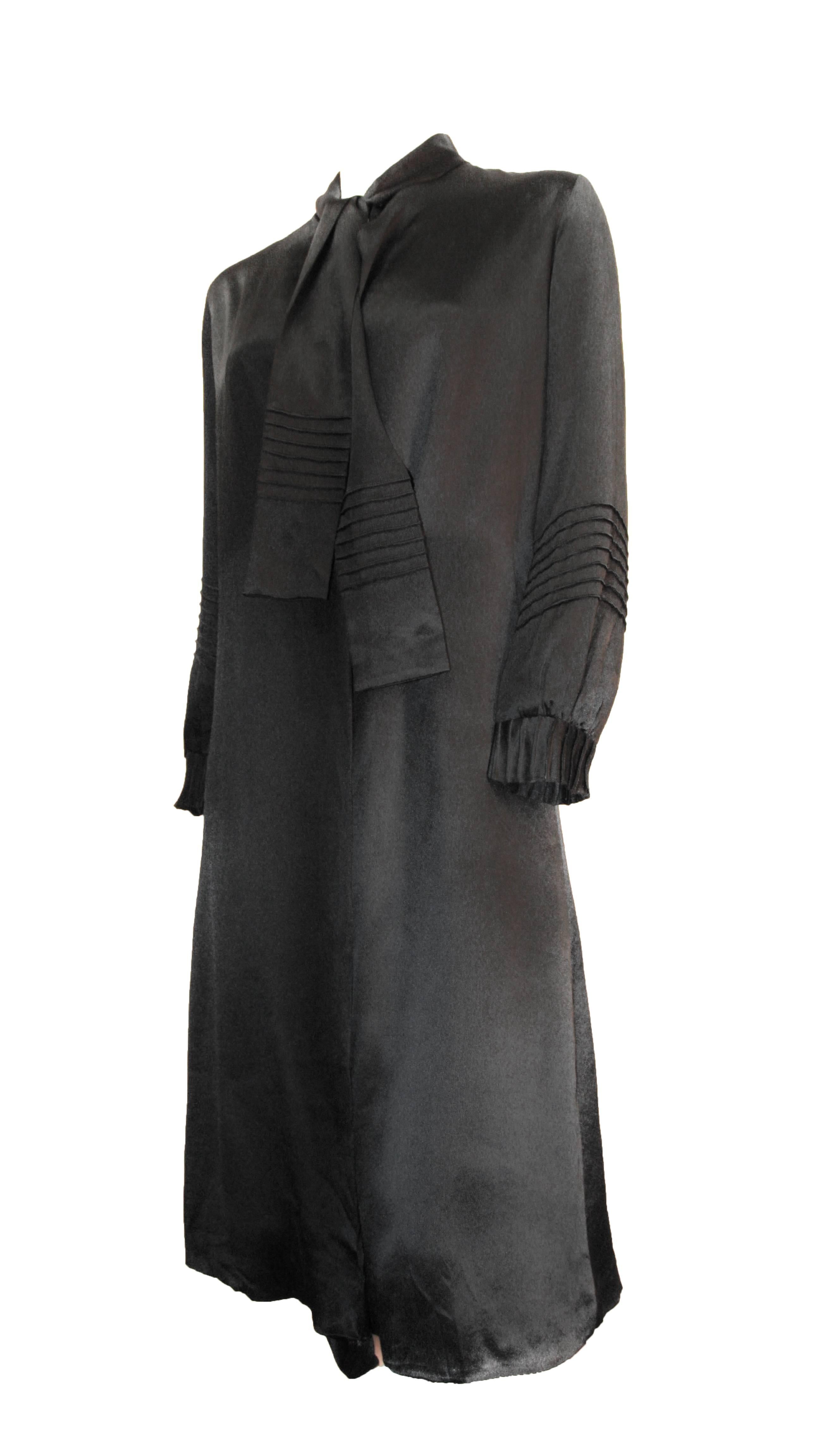 20s black silk coat dress with neck tie and silk covered center button. Fully lined in cream colorer silk. 