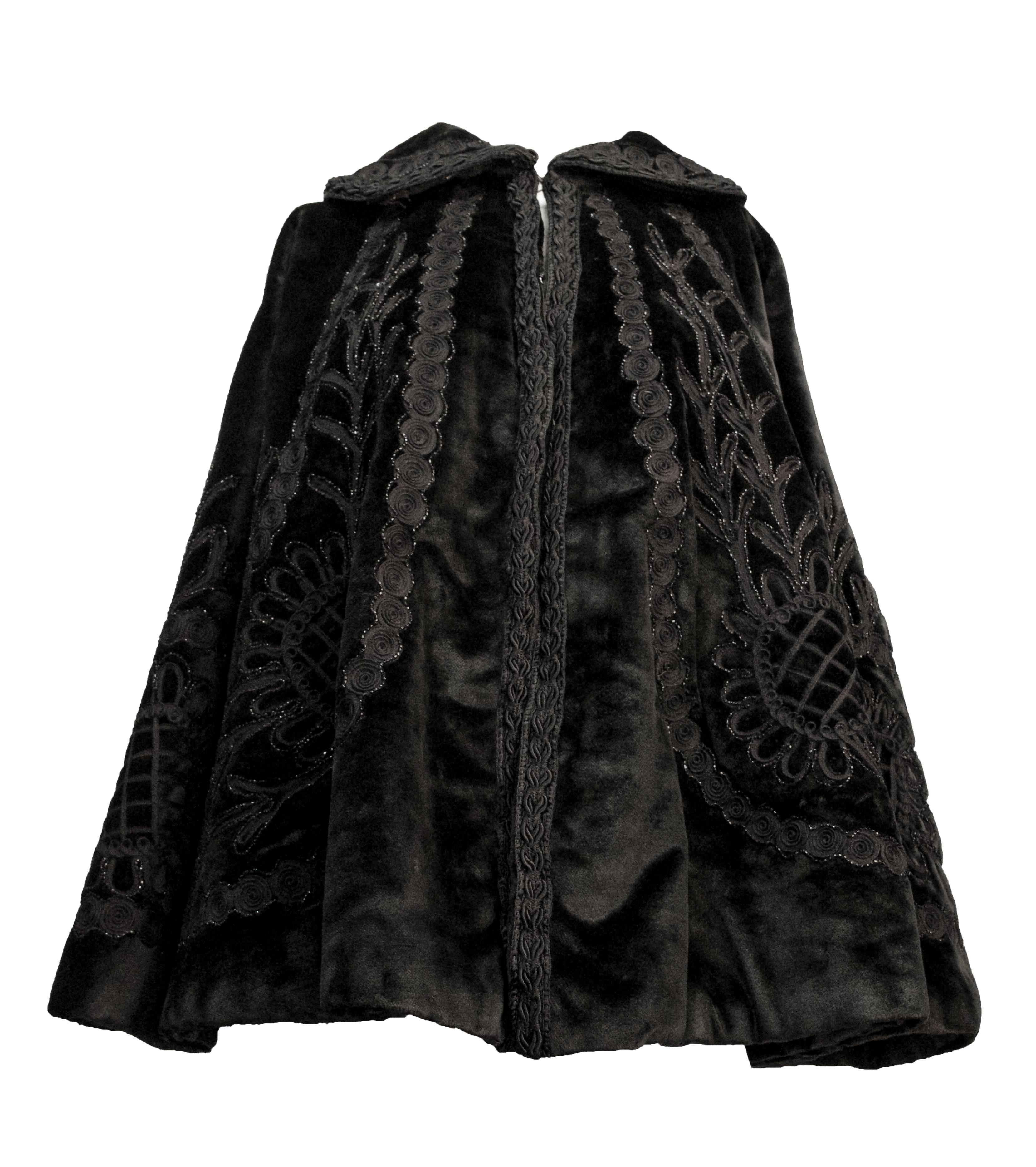 Edwardian black velvet heavily beaded cape. Soutache trim along collar and front opening. Has been beautifully re-lined in black satin. 