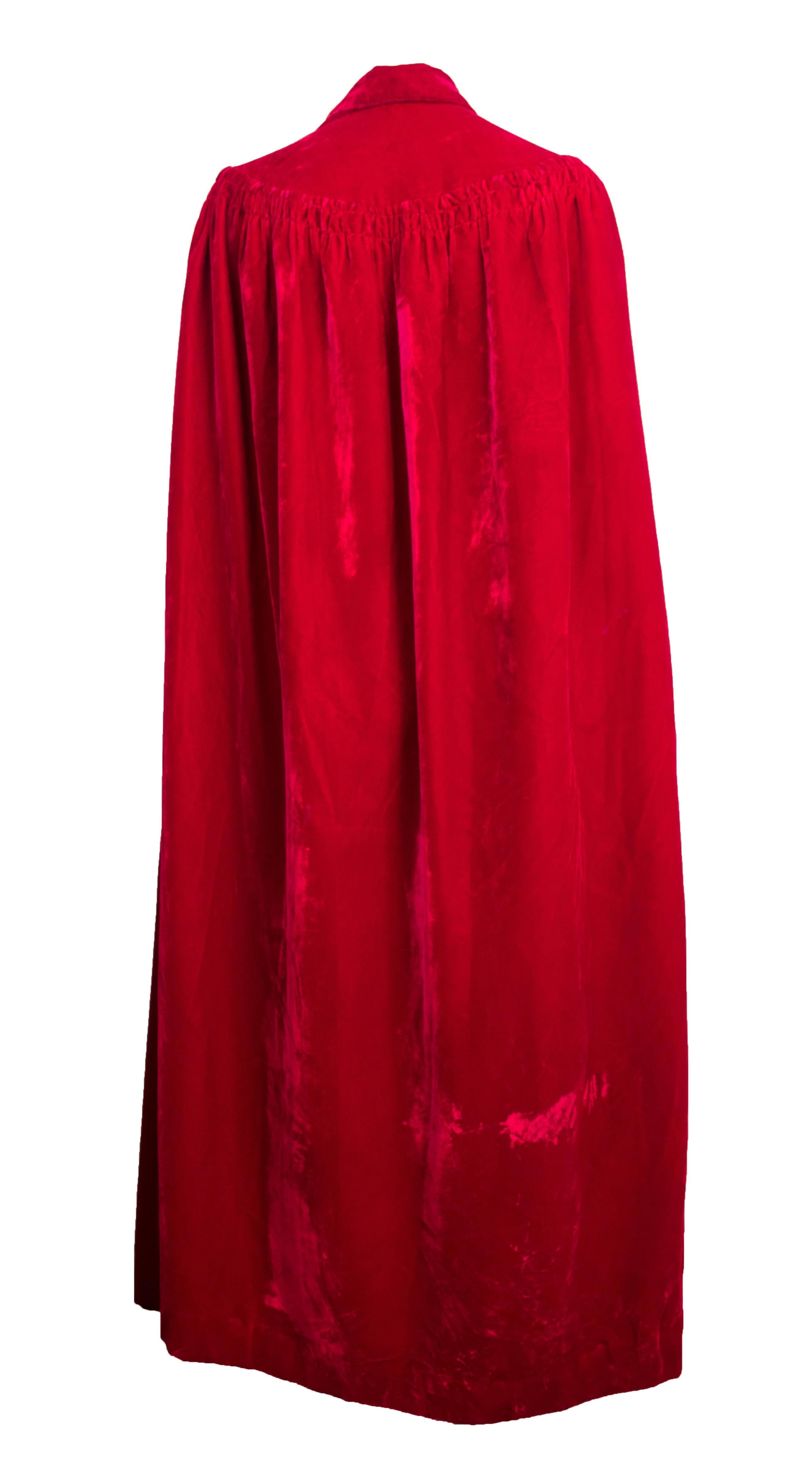 50s red velvet full length cape. Attached neck ties. Fully lined in cream colored fabric