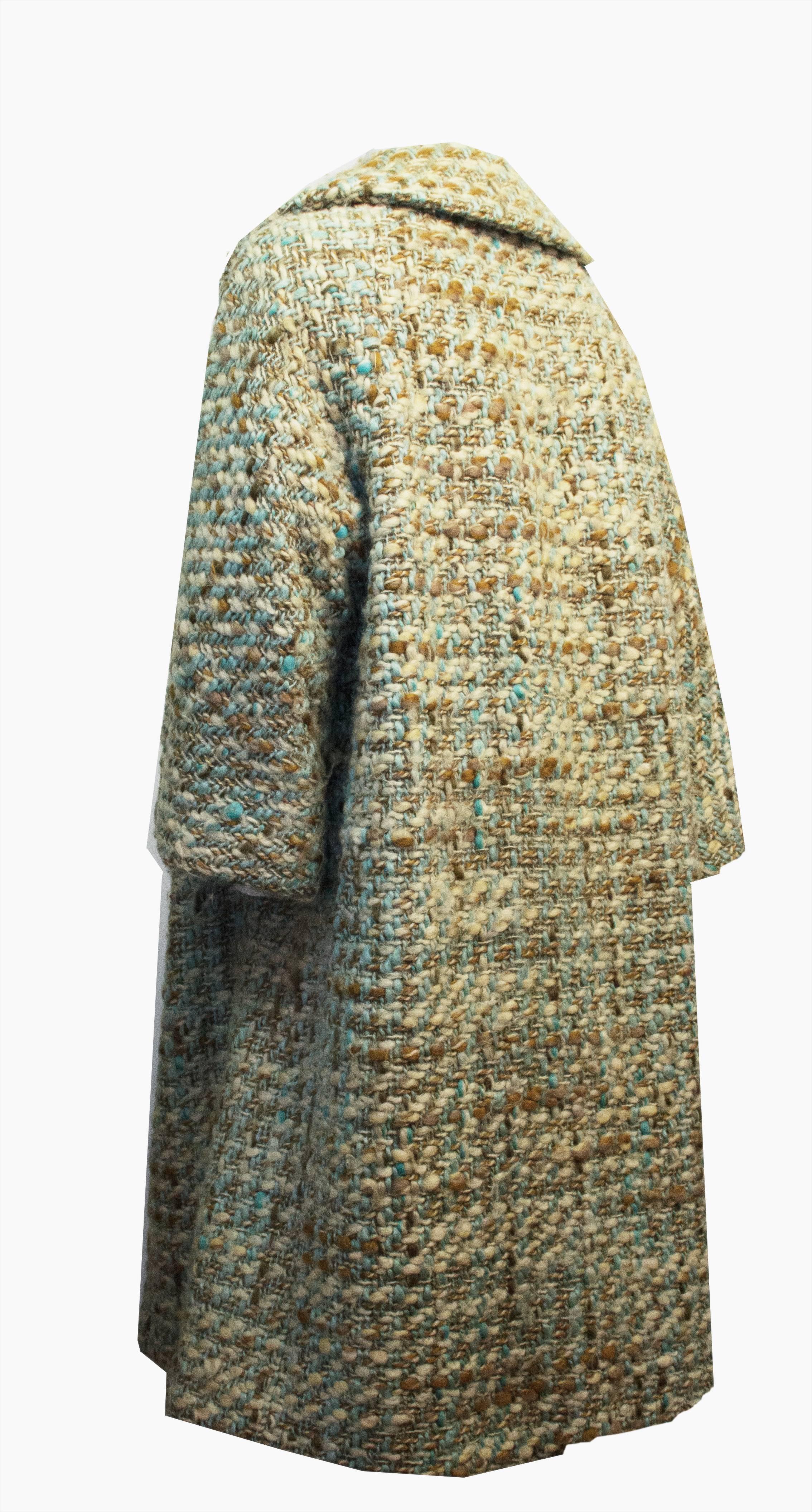 1960s Lilli Ann loose-weave tweed coat. Two front welt pockets. Notched collar. No front closure. Blue satin lining. Raglan 2/3 glove sleeve. 

16