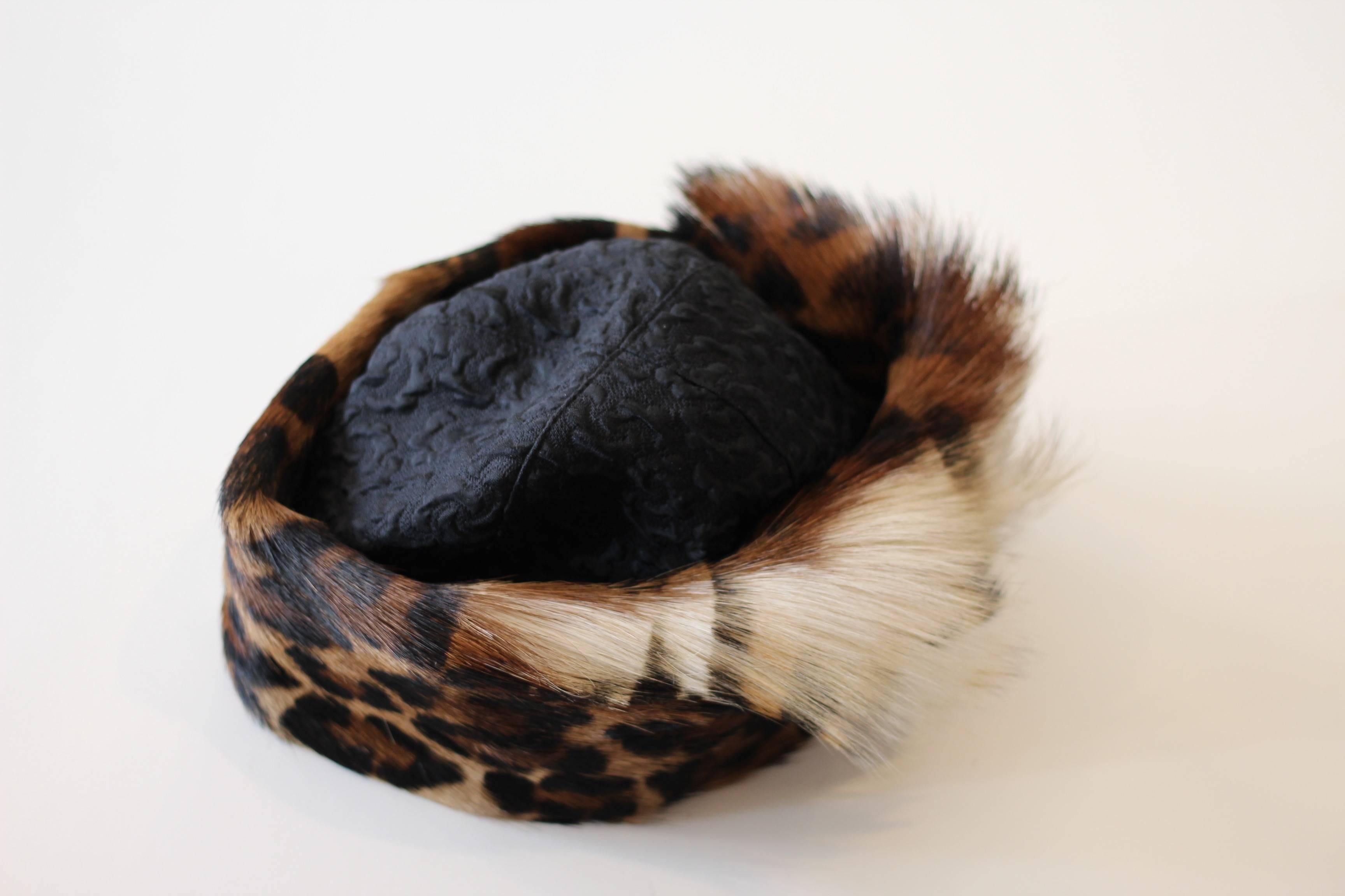 Top off your look this winter with this 1970s Deborah Harper Leopard Hat. The top of the hat features textured silk and is surrounded by a 3.5