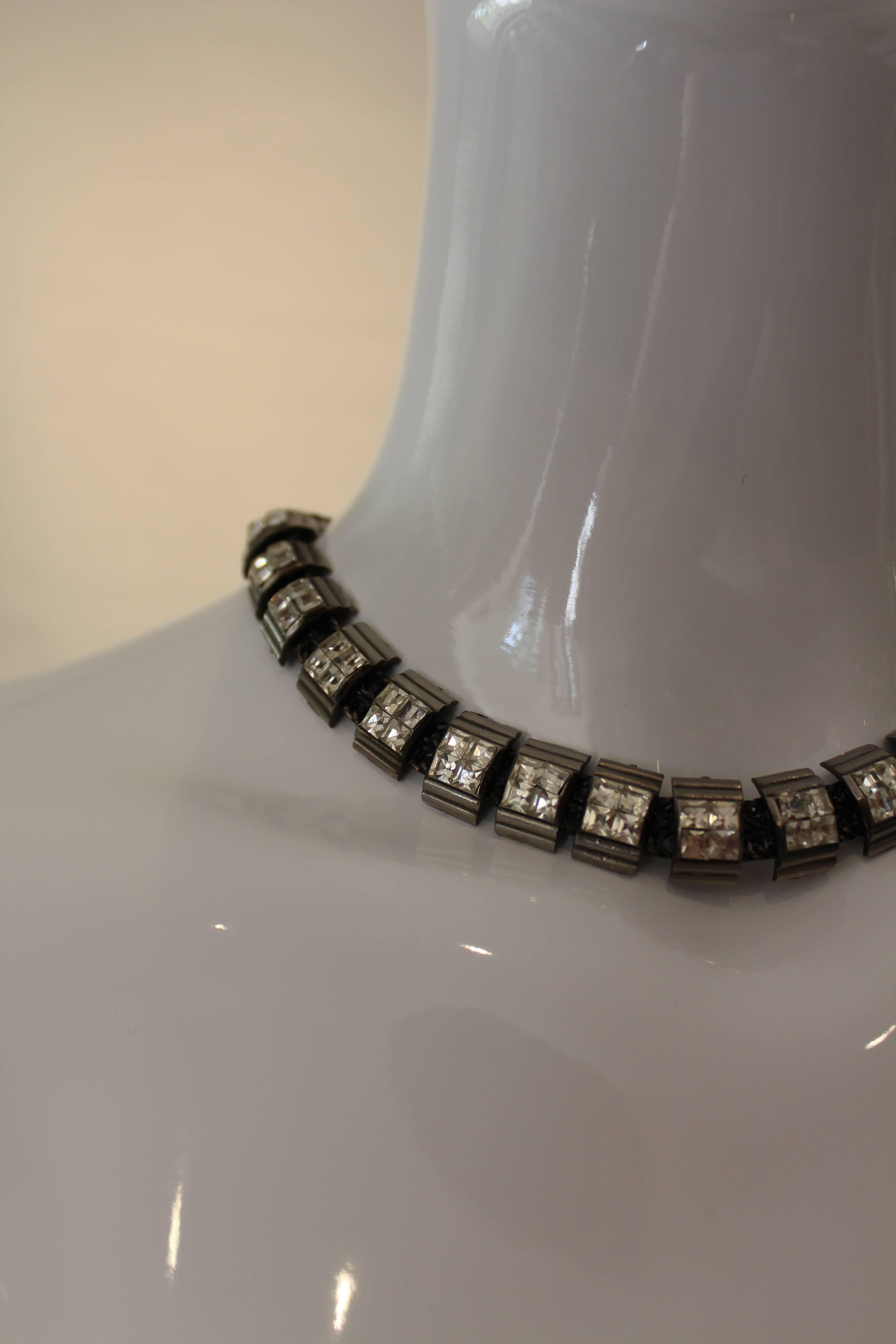 This modern mesh chain Fendi necklace is well constructed and finished off with Fendi logo clasp.  It's oxidized dark silver tone chain with chunky rhinestone embellishments would be  a great investment piece for any fashionista.
