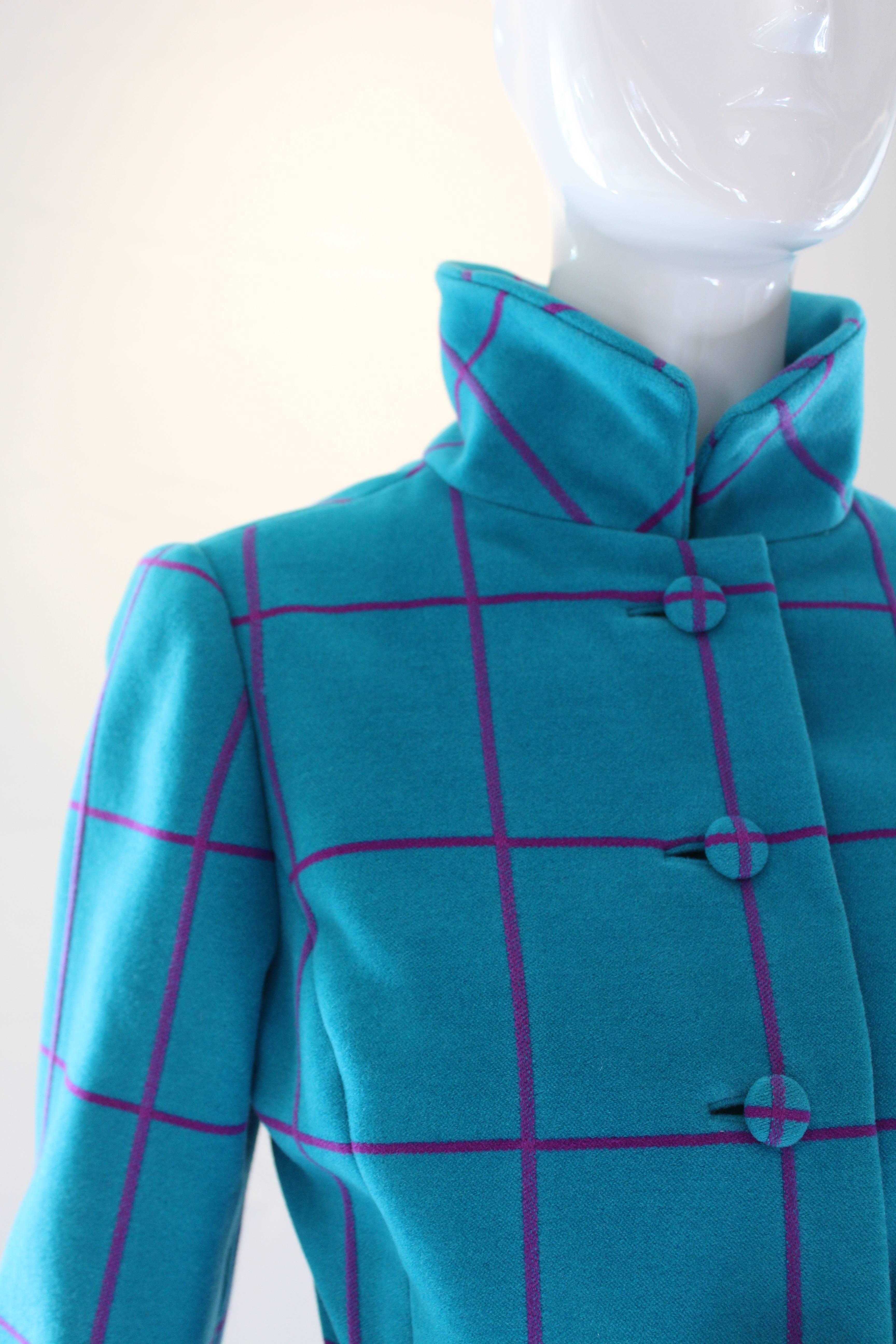 It doesn't get much better than an Oscar de la Renta early 60's knit jacket in vibrant turquoise and purple windowpane.  The darling peplum and wide belt with goldtone rectangular buckle add such charm.  Details such as covered buttons and