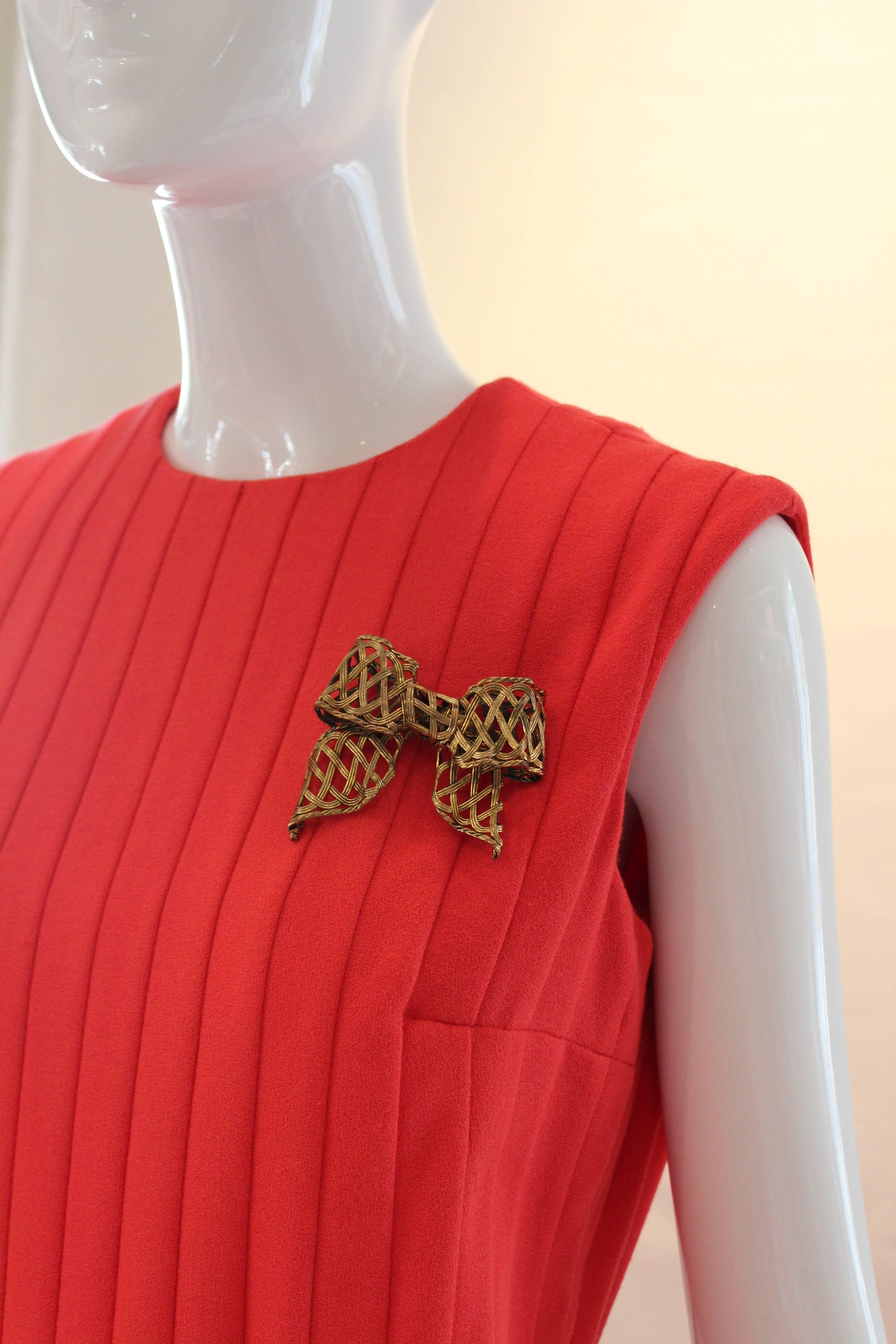 This large bow brooch by Sonia Rykiel is three dimensional and has basket weave texture.  Signed - this piece is simply stunning.

Measurements in inches: 
Hight: .75
Width: 2.75
Length: 2.75