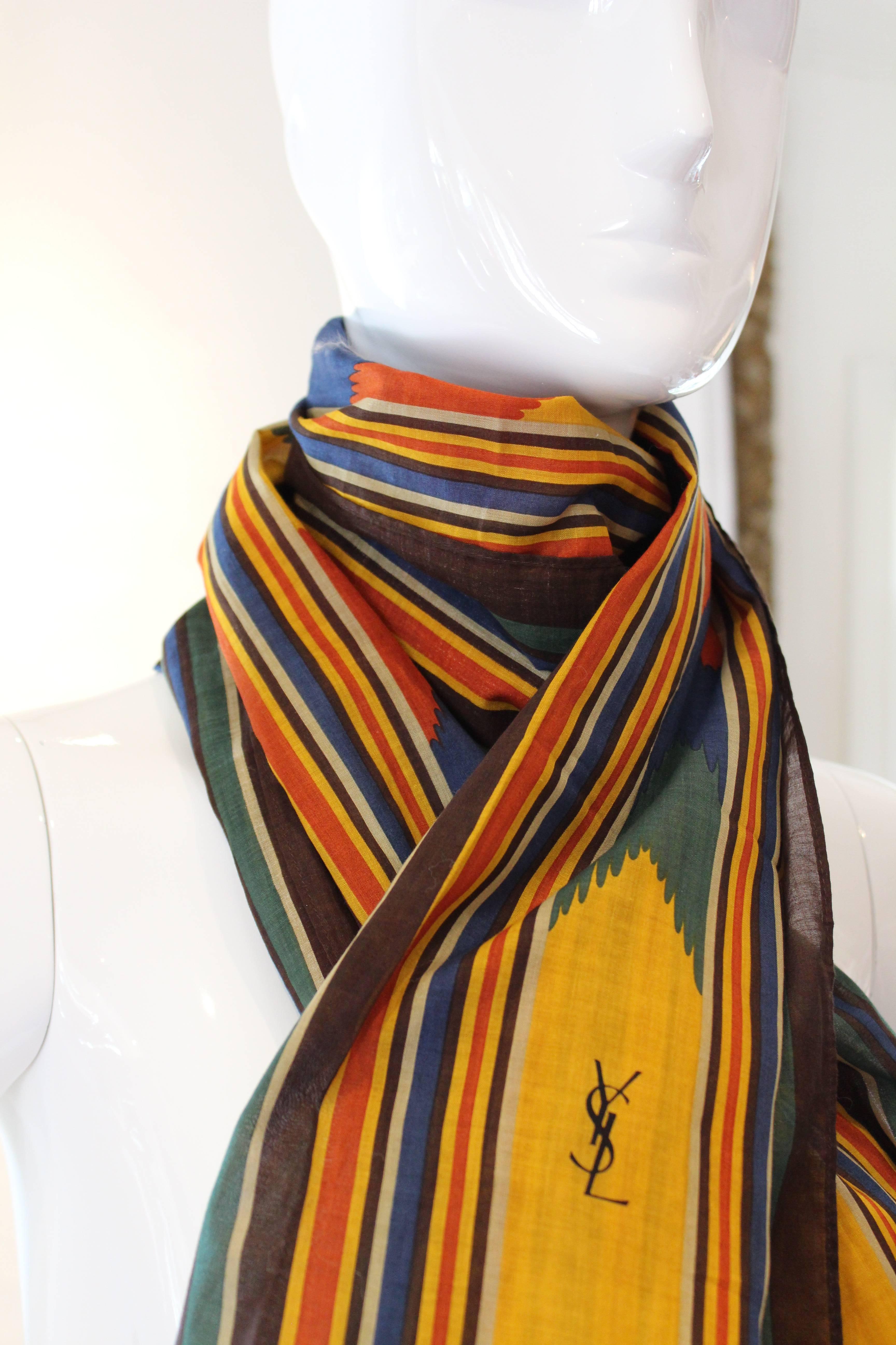 This fantastic cotton rectangular striped scarf would spice up any wardrobe.  Very functional, lightweight and the beautiful quality you appreciate from this collectible designer.  Quite a versatile piece and large size make it a good