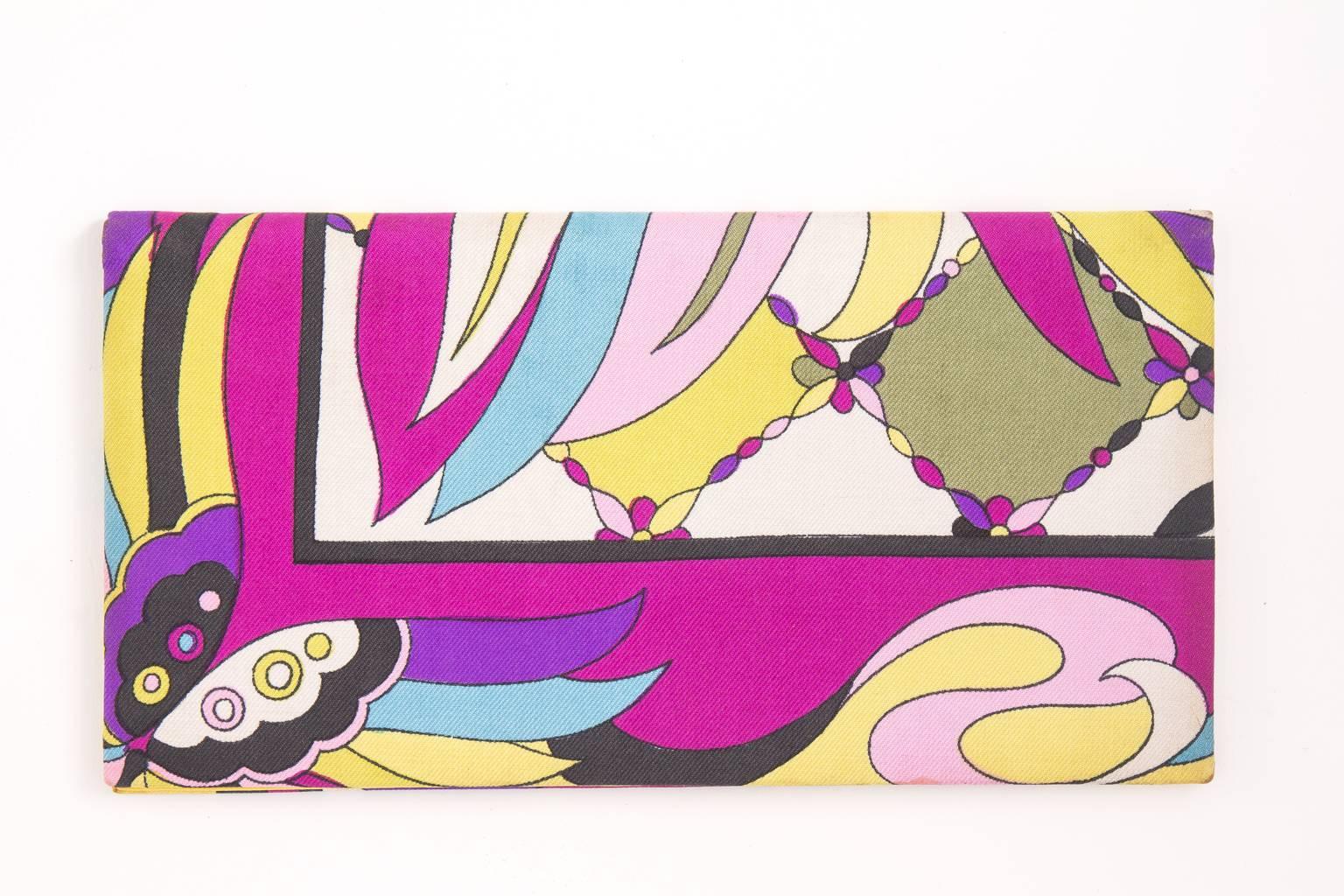 funky finders has this circa 1960's Emilio Pucci checkbook clutch wallet. it features a signature print with fabulous yellow leather interior including 2 compartments. it's a never used Pucci premium from 1st national bank NY. Rare to survive in