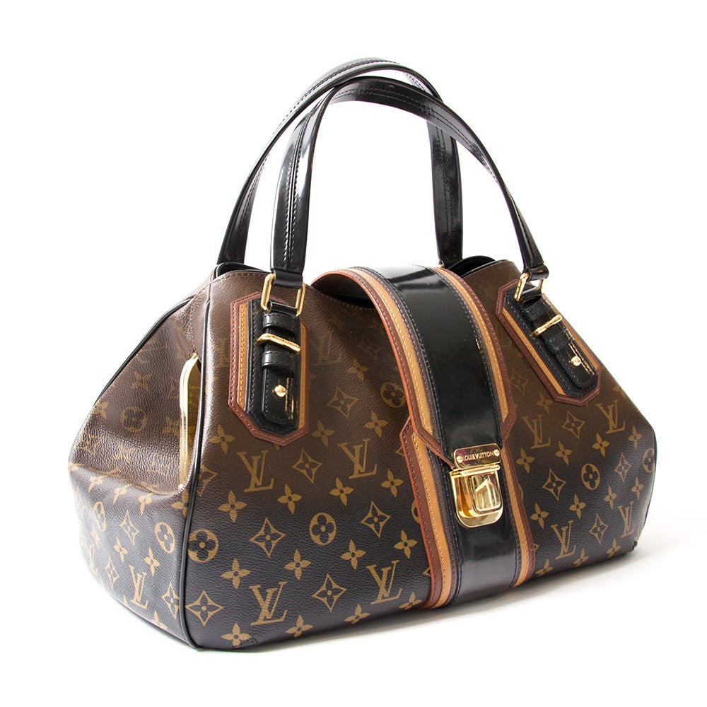 For the Fall 2007 Collection, Louis Vuitton elevated their signature Monogram bags to works of art with an extremely limited run of runway Mirage bags. 
This Limited Edition Mirage Griet Bag is an ultra-rare bag crafted with Bordeaux and mustard