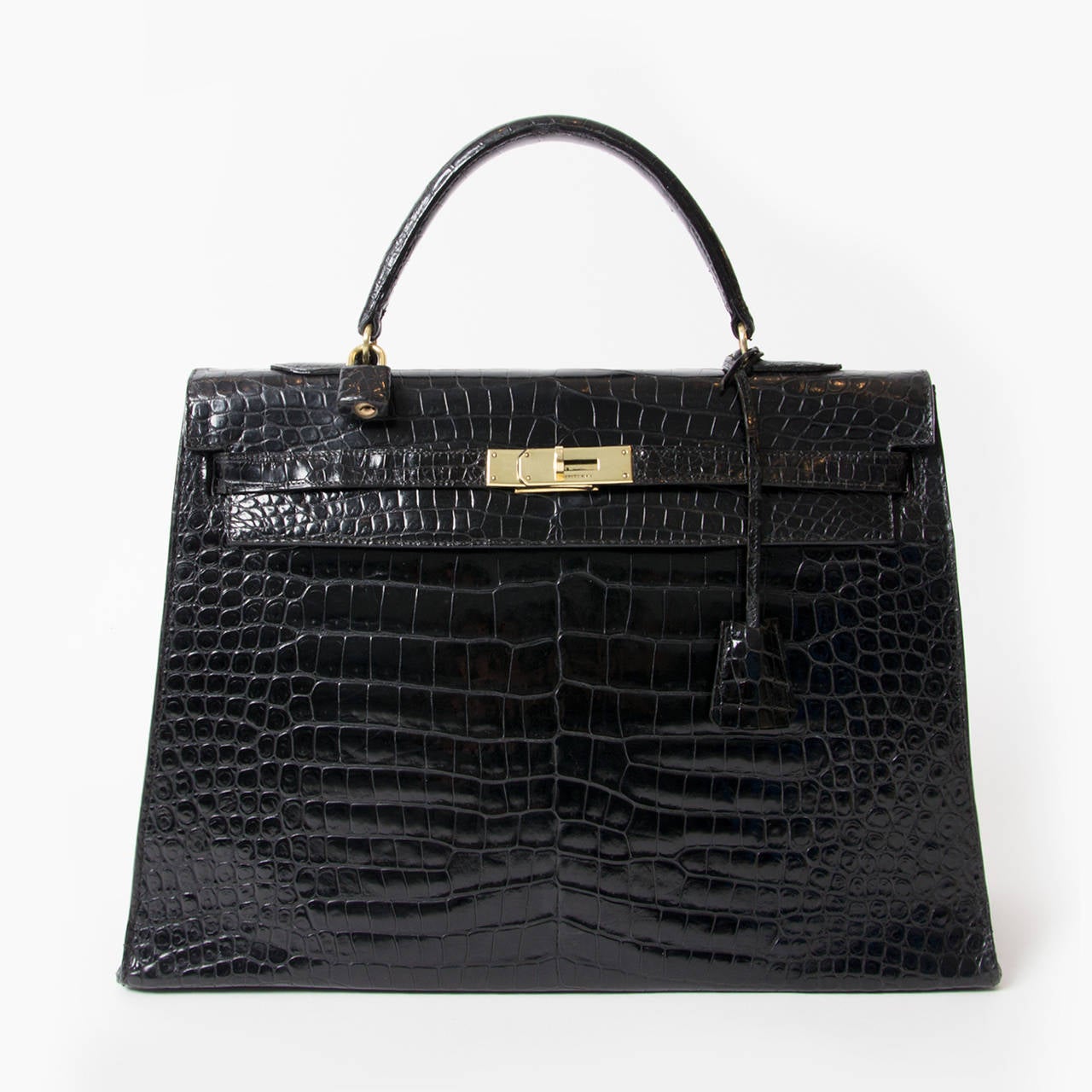 Hermes Kelly 35 handbag in Porosus crocodile with gold hardware
Black color
Crocodile Porosus
Excellent condition
This Kelly 35 Porosus will come with dustbag, clochette , lock gained and keys
Blind Stamp Reads Letter: T 

A timeless classic,