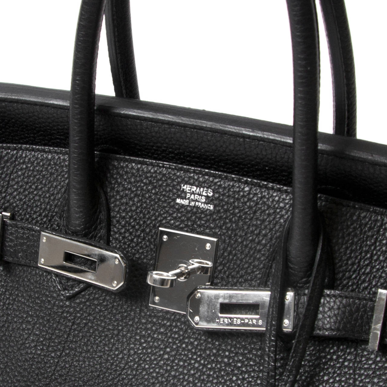 Hermes Birkin 30cm Togo Black PHW
Hermes Black togo leather Birkin 30cm with tonal stitching, palladium hardware, clochette with lock and two keys, black chevre lining with one zip pocket with Hermes engraved pull and open pocket on opposite