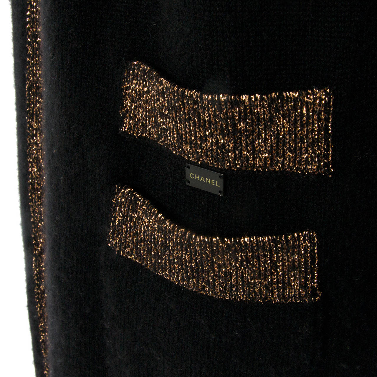 Chanel open black and gold Cashmere cardigan.