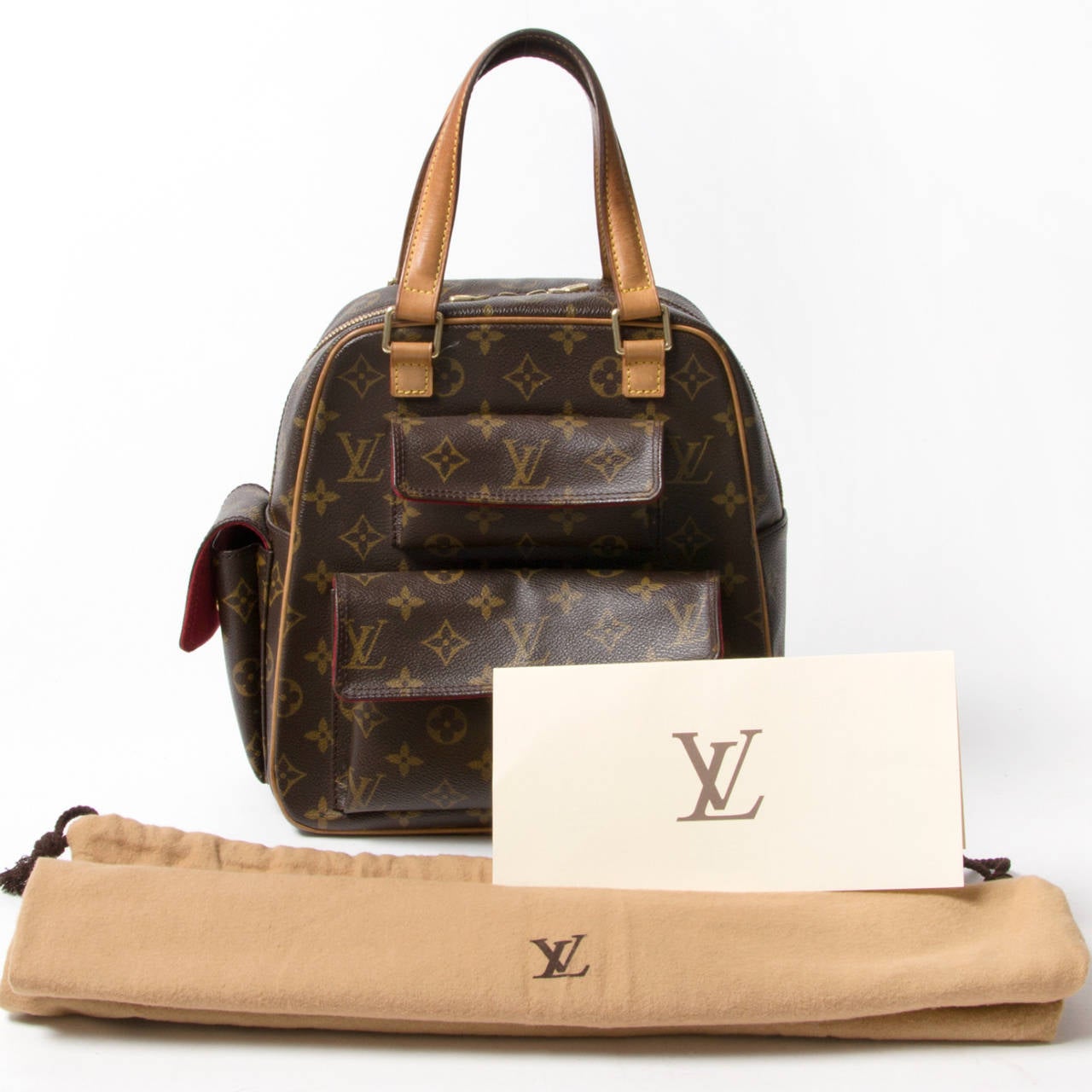 Louis Vuitton monogram canvas Excentri Cite handbag. Stylish and practical, with a unique structure to hold all your daily essentials. Made out of the tradition monogram LV canvas with vachetta leather trip and handles. Brass hardware. The front