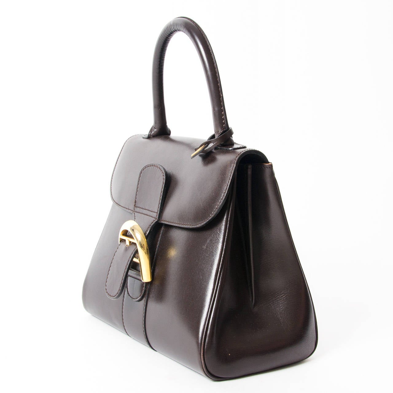 Delvaux Brillant PM with gold hardware in a gorgeous chocolate brown leather material. This classic satchel from premium Belgium luxury leather goods brand Delvaux excels in both style and quality. Top handle for comfortable and elegant use. Iconic