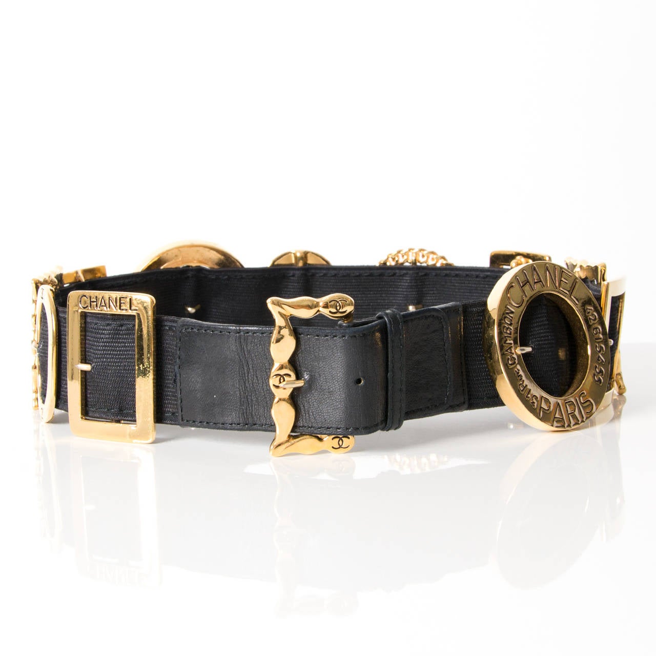 This Chanel statement pieces features numerous gold buckles in different shapes and sizes, all adorned with Chanel logos. The black and gold color combination makes it a classic piece to add to your wardrobe.