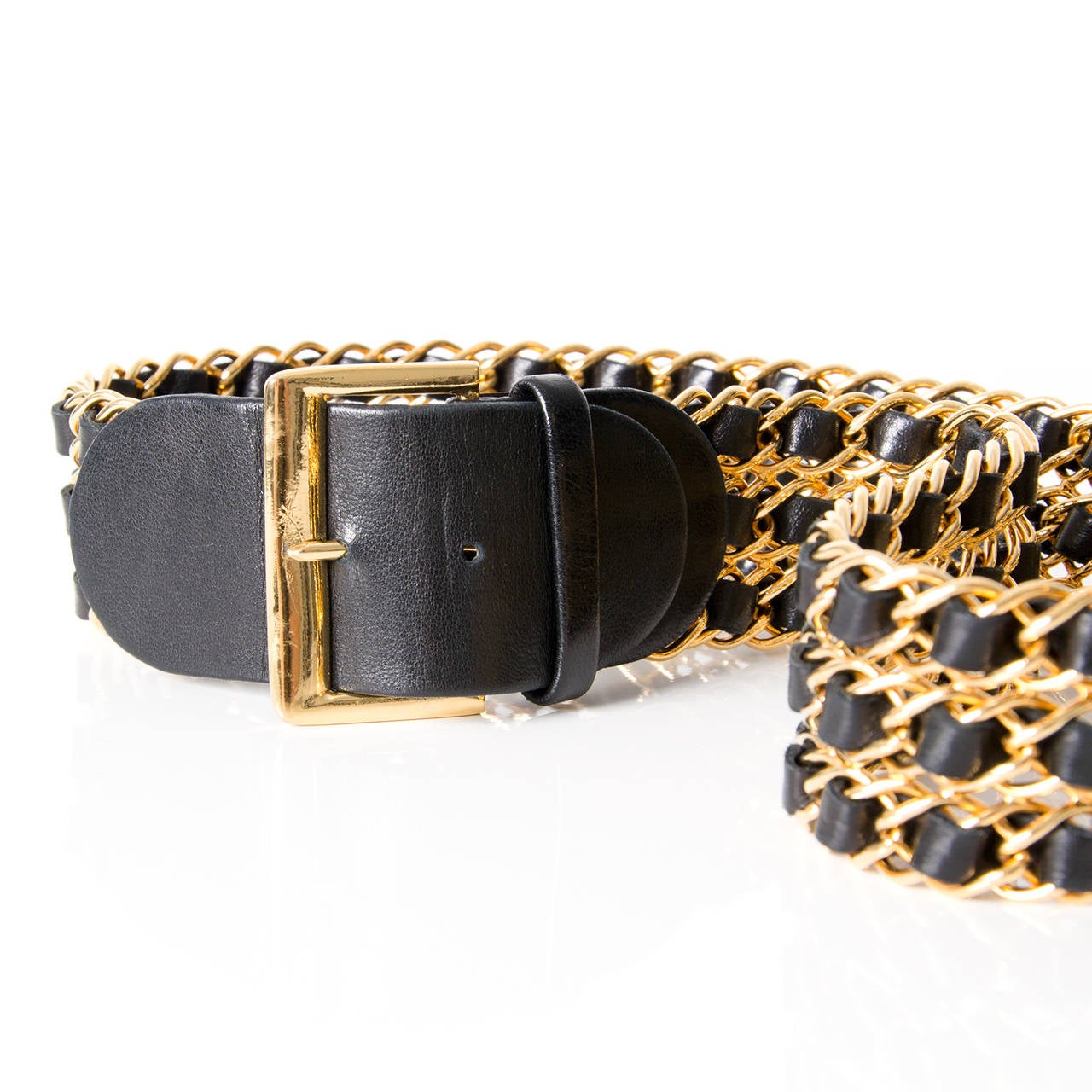 Chained belts have always been key accessories from the house of Chanel. This black and gold triple chain belt is designed to be a real head-turner and is highly collectible.