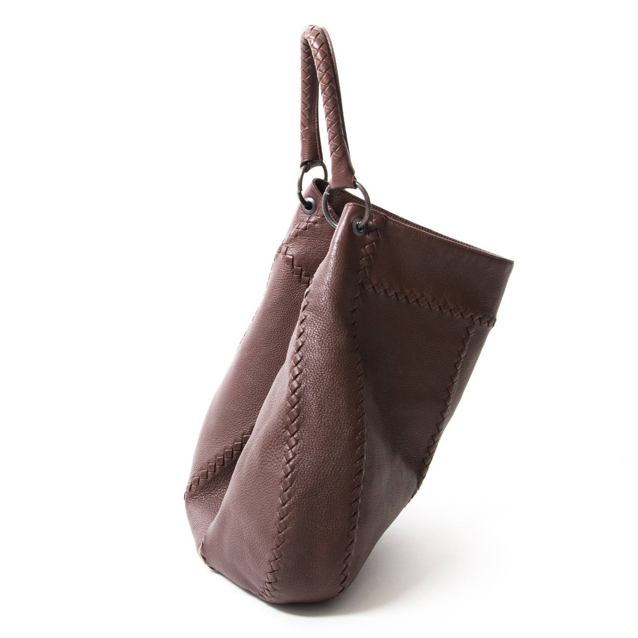 Simple but elegant looking. The luxurious leather design is accentuated an artisan braided shoulder strap and trim has super-soft suede lining.

It has a single braided shoulder strap, internal zip pockets and women would never worry about room