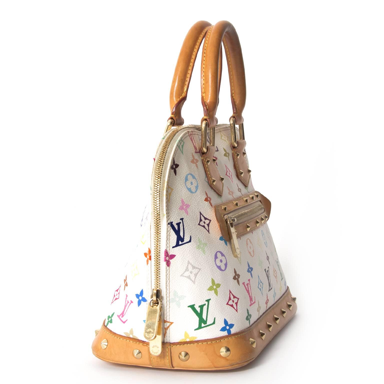 Enjoy the colorful monogram print on this special series Louis Vuitton Alma satchel created by Japanese artist Takashi Murakami.
After 12 years of being an IT-bag of many celebrities, the Murakami Multicolore line was discontinued by Louis Vuitton