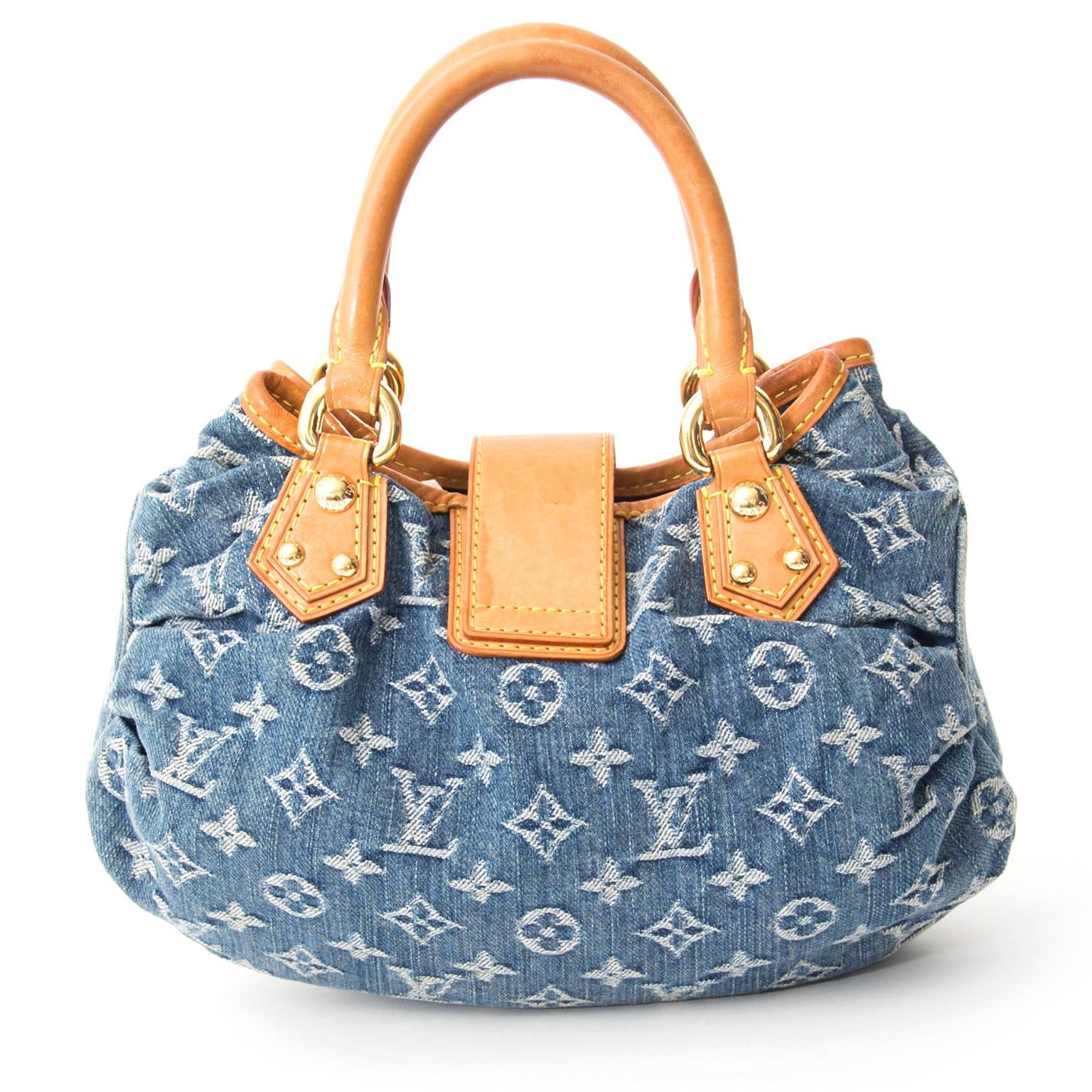 Louis Vuitton Mini Denim Monogram Bag.

Bag with a golden buckle and yellow suede lining.

Go for a casual denim look with this cute little bag.
