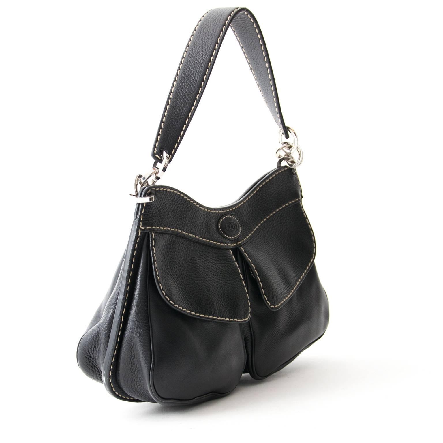 Tod's Black Shoulder Bag 

This bag is classy and will finish your outfit with elegance.
It features silvertoned hardware, beige stitching and two front pockets.

 