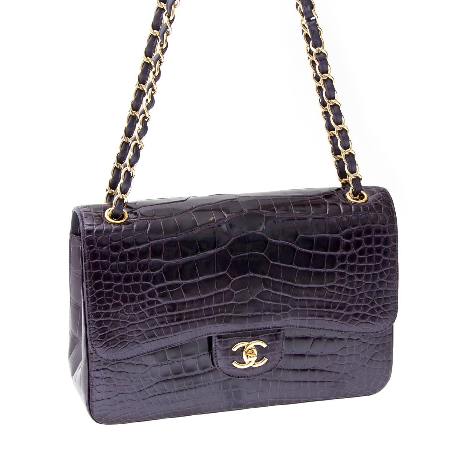 This stunning rare Chanel shoulder flap bag is superbly crafted of luxurious exotic 