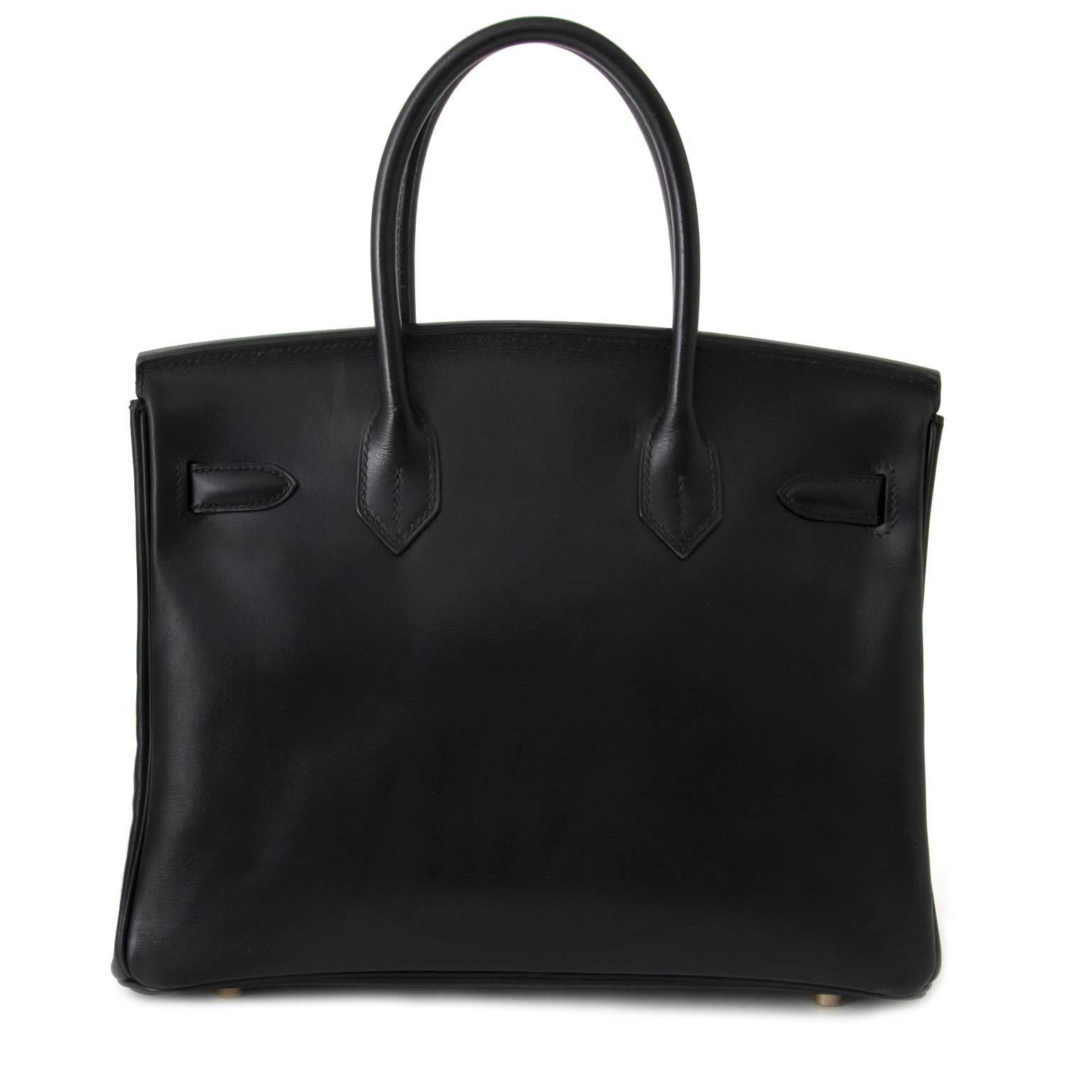 Hermès Black Birkin bag in Box Calf leather.

This beauty is made of smooth and glossy calf skin that is more rigid than the grainy leathers, the box calf leather develops a highly desirable patina over time.

 Blind Stamp E in a square