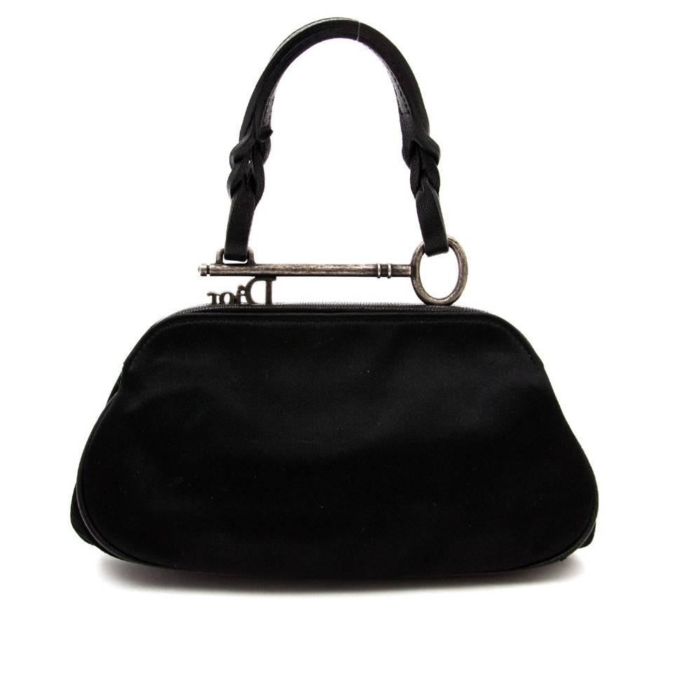 This Christian Dior Black suede and nylon Gaucho Saddle Bag is a popular style known to Dior fans everywhere.
It features gorgeous and soft suede leather with a chunky buckle, medallion and key hardware. The foldover flap gives this bag a true