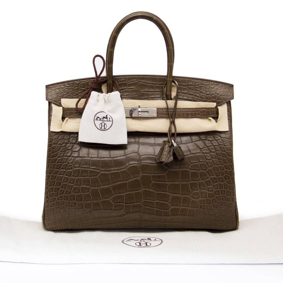 Hermes Birkin In The Most Beautiful Crocodile Alligator Matte Gris Elephant With palladium hardware.

The Gris Elephant color is incredibly sought-after and rare.
 Neutral Olive Shade With A Silvery Sheen.
The Color Is Simply Devine Depending On