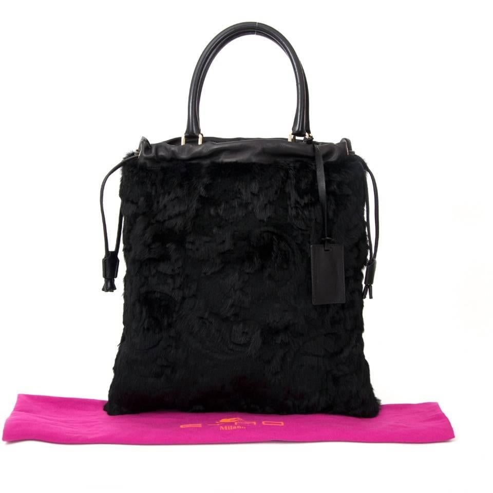 Etro Black Rabbit Fur tote with gold hardware. The bag has a fun paisley design in the fur. Practical pockets on the inside and closes when you pull the straps on the sides. Comes with dustbag and an Etro-tag.