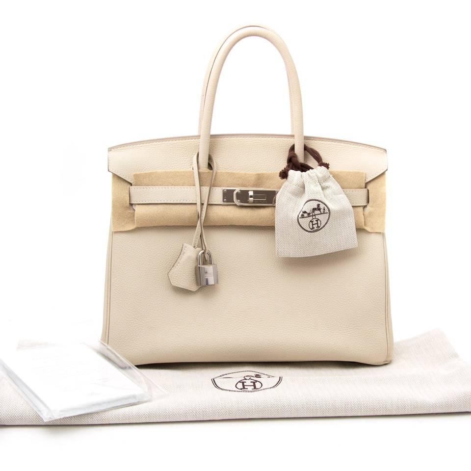 This stylish Birkin is beautifully crafted of ever calf leather in an antique pale beige. 
This hard to find Birkin bag is still in good condition , corners and bottom of the bag show some signs of wear as you can see on the pictures. 

The bag